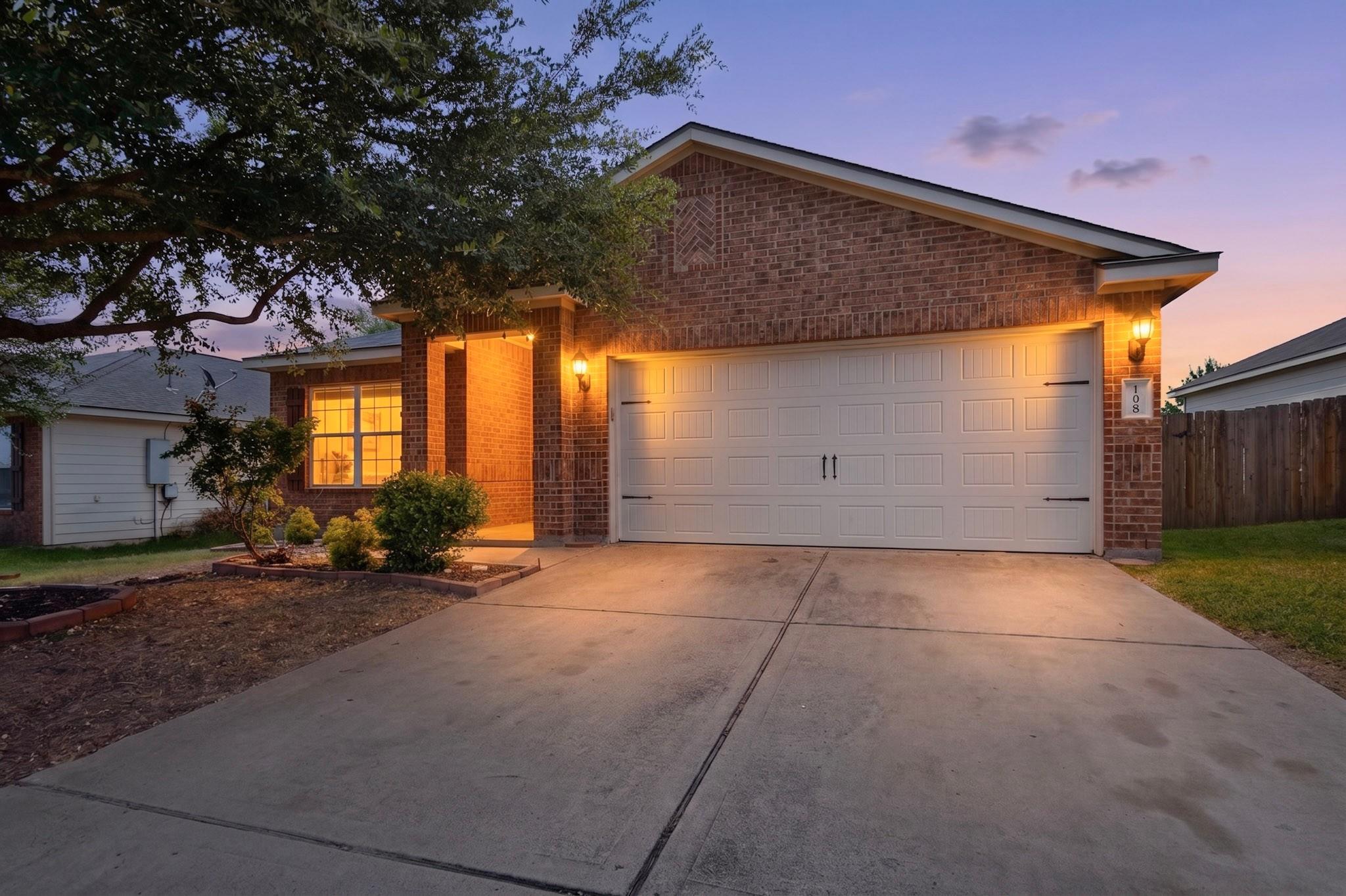 A welcoming brick exterior with a well-lit entran