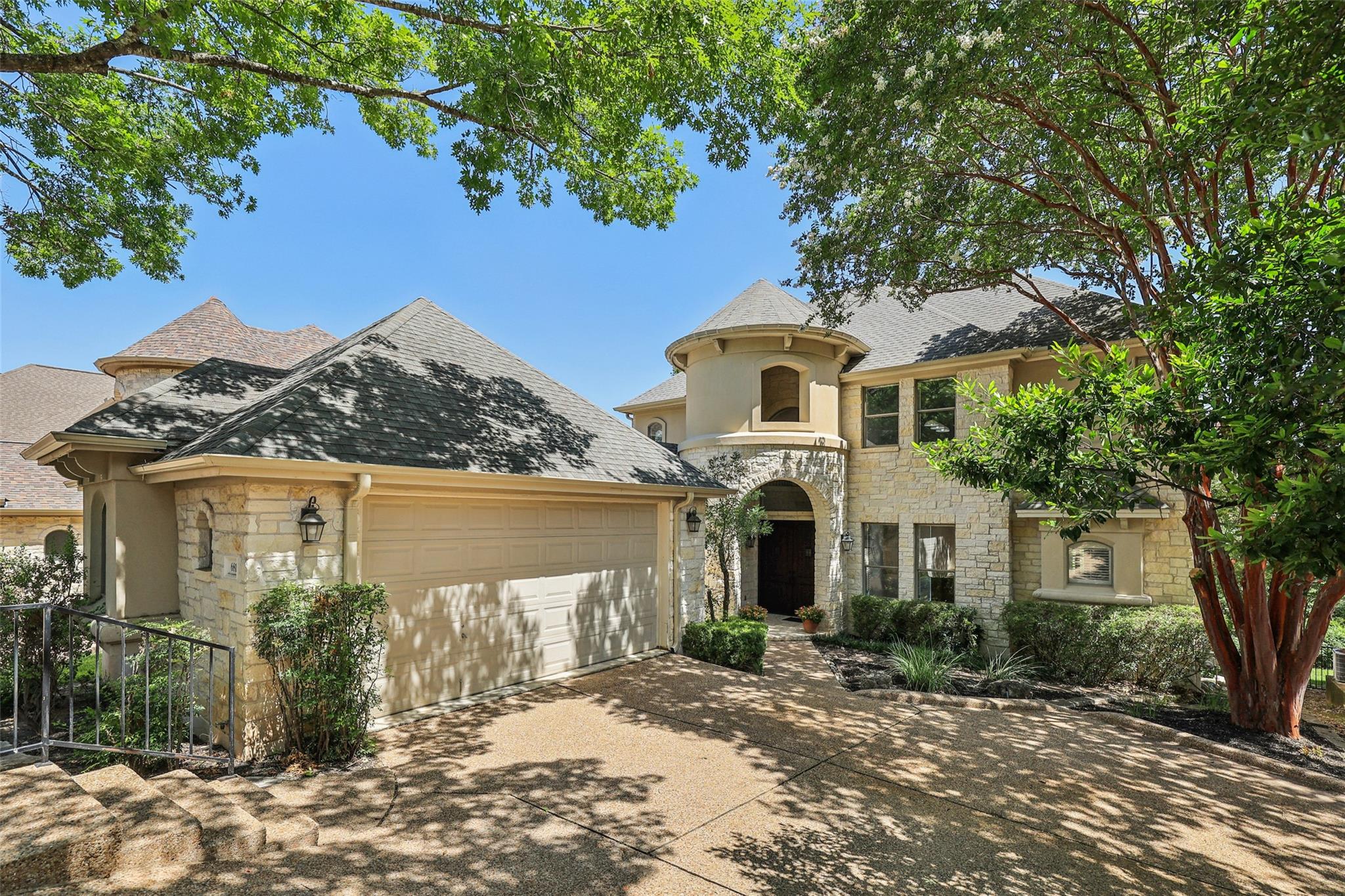 A grand, multi-level residence with a prominent s