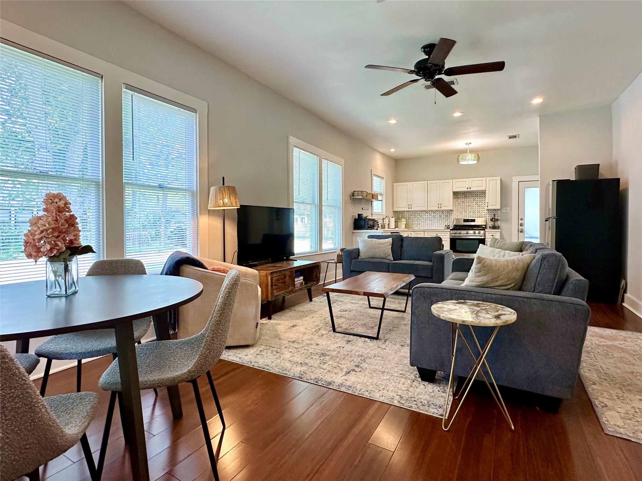 Open-concept living space featuring wood-finish f