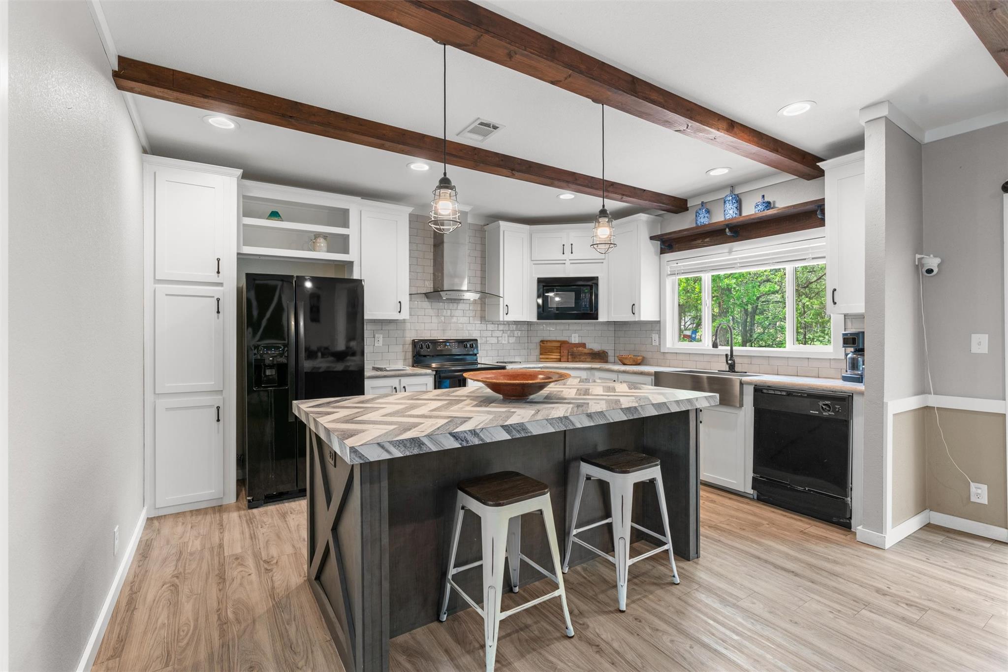 Modern kitchen featuring a central island with a 