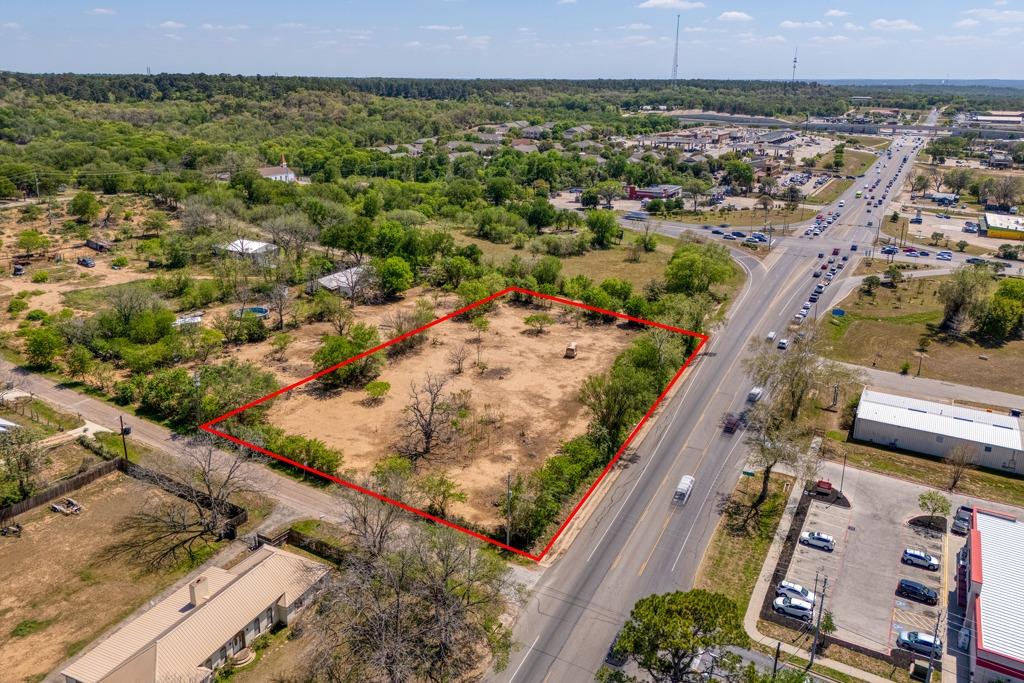 Expansive undeveloped lot featuring mature trees 