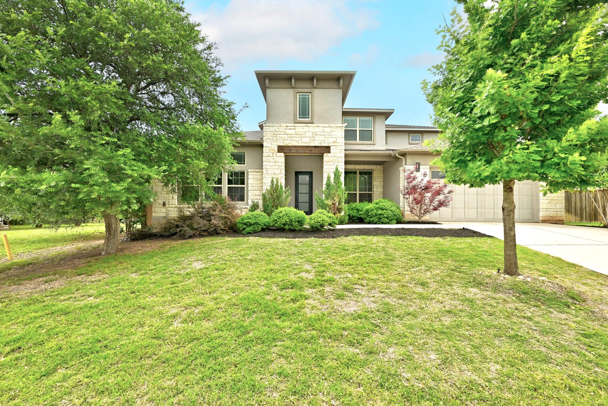 Contemporary exterior with stone and stucco finis