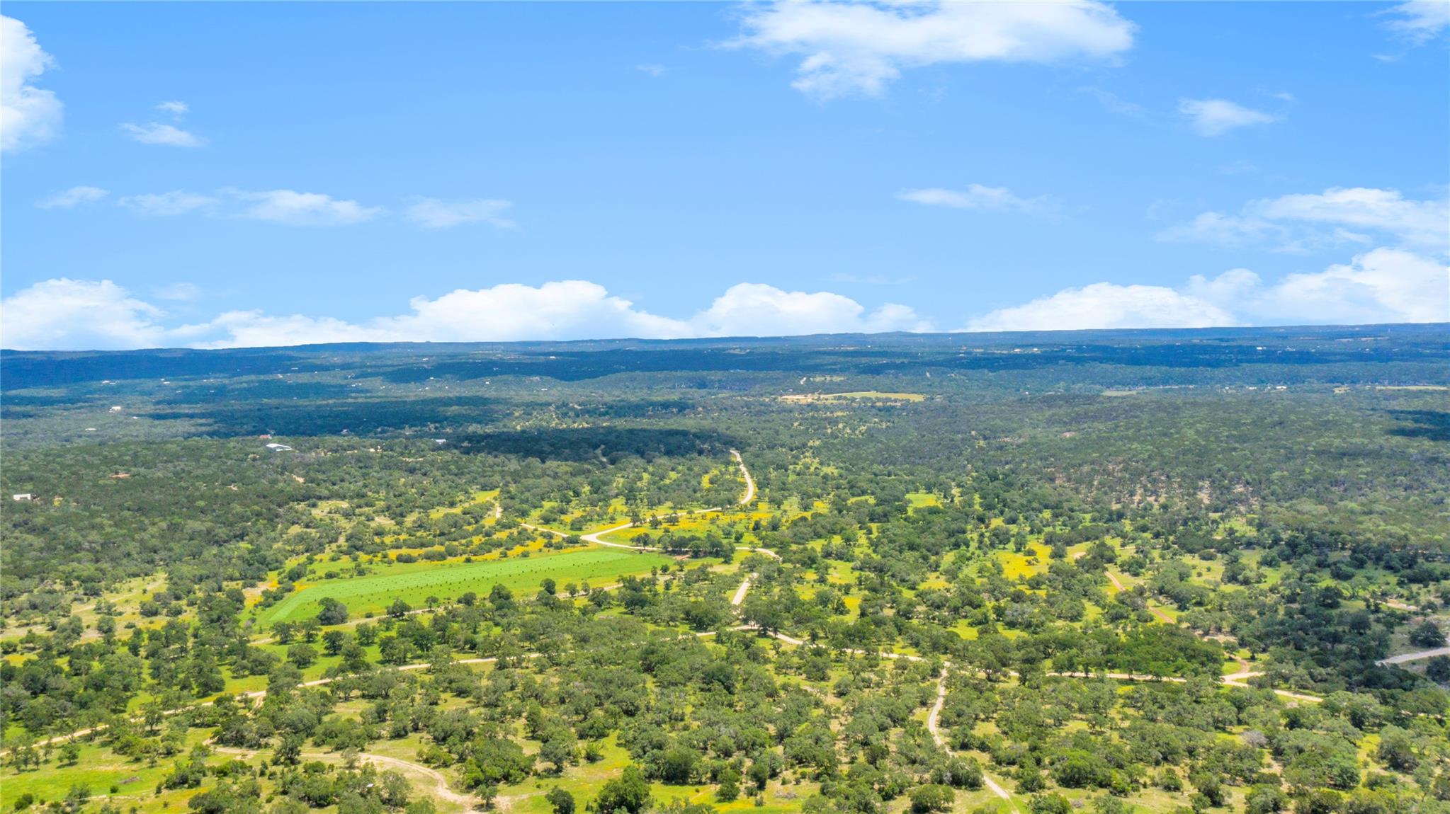 Expansive rural landscape featuring a mix of dens