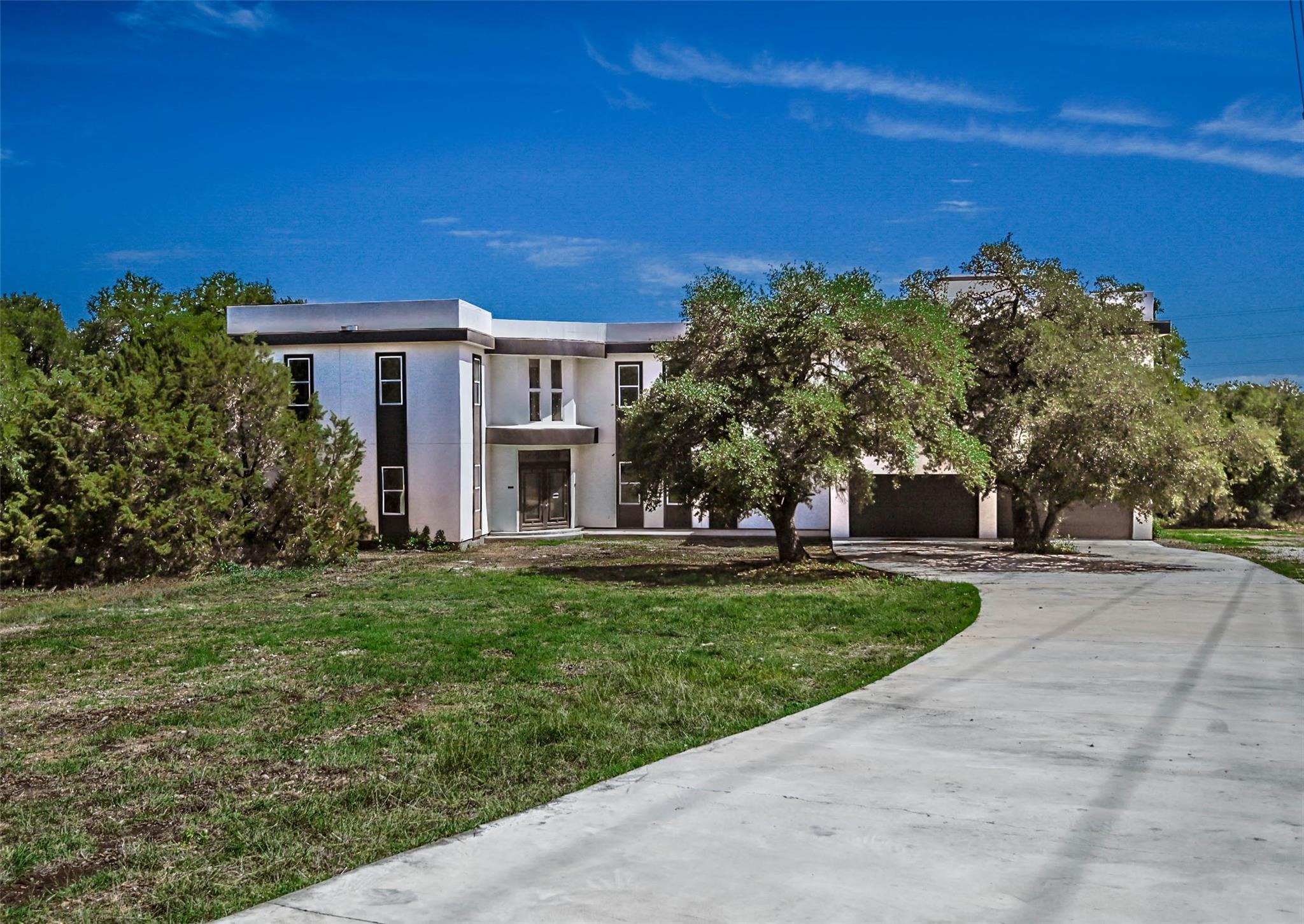 Contemporary two-story residence with a white fac