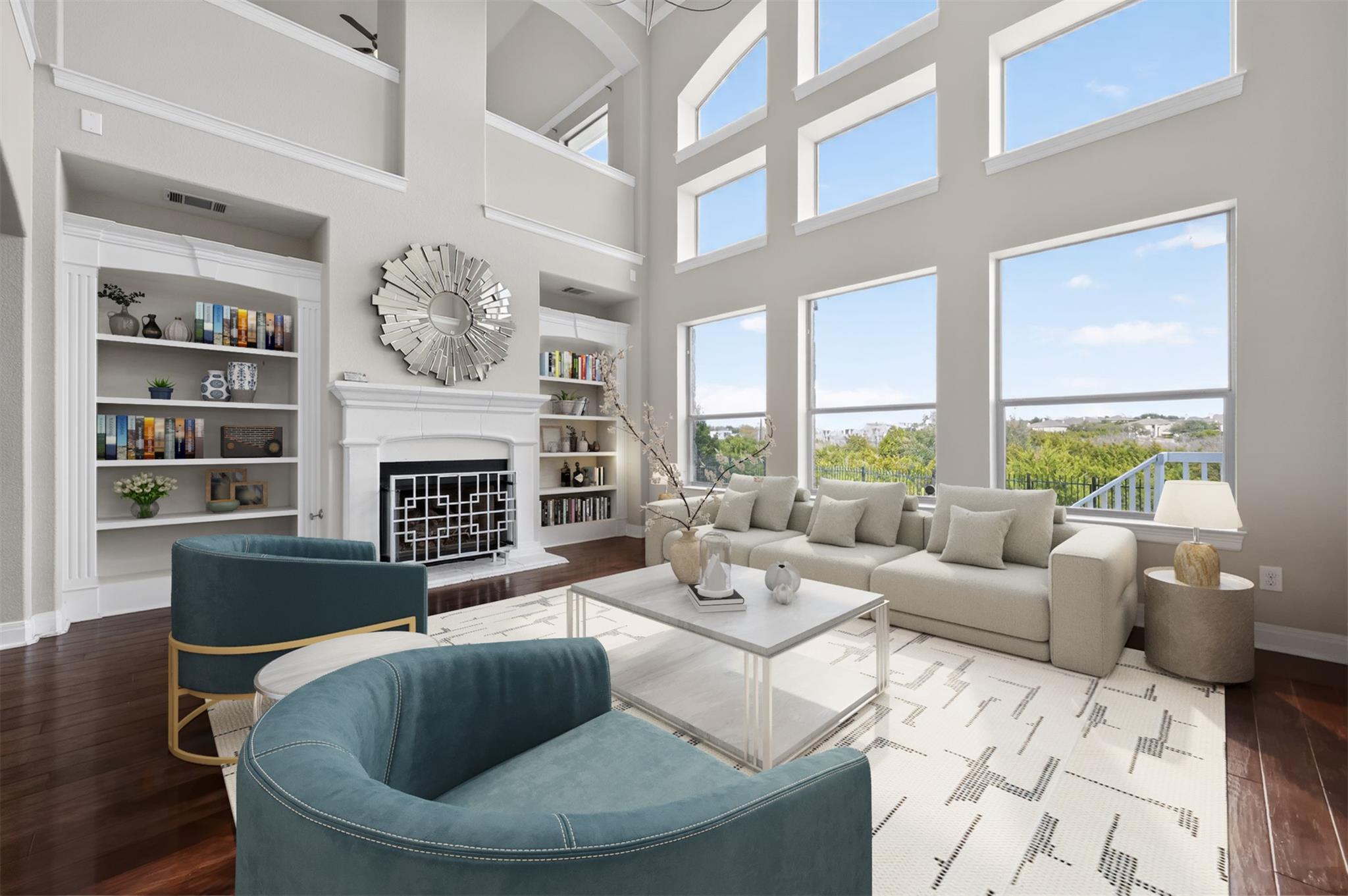 Two-story living area featuring a fireplace with 