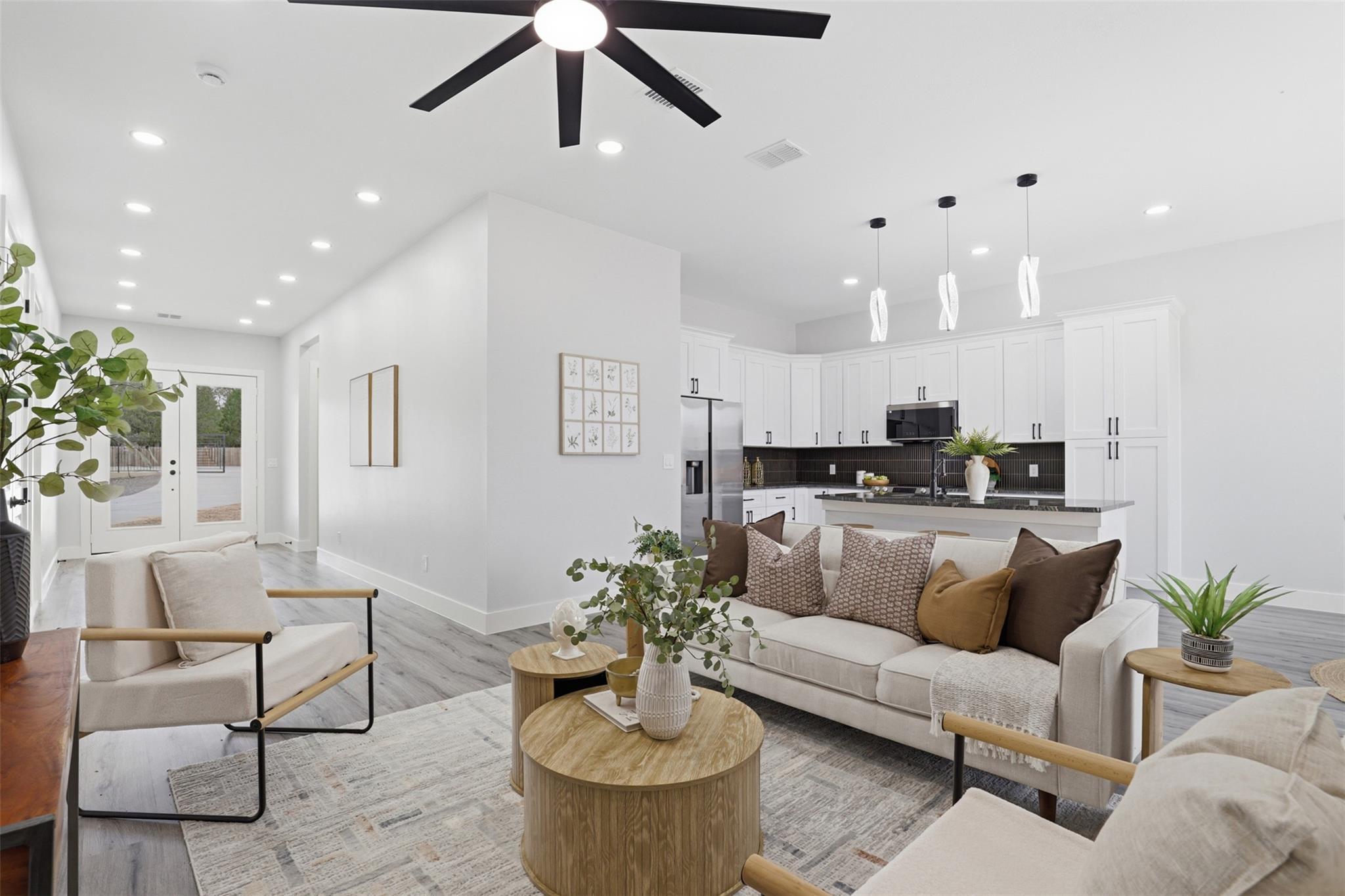 Open-concept living space with recessed lighting 