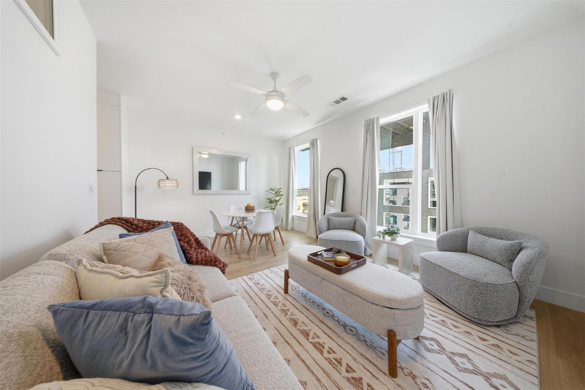 Open-concept living space featuring wood-finish f