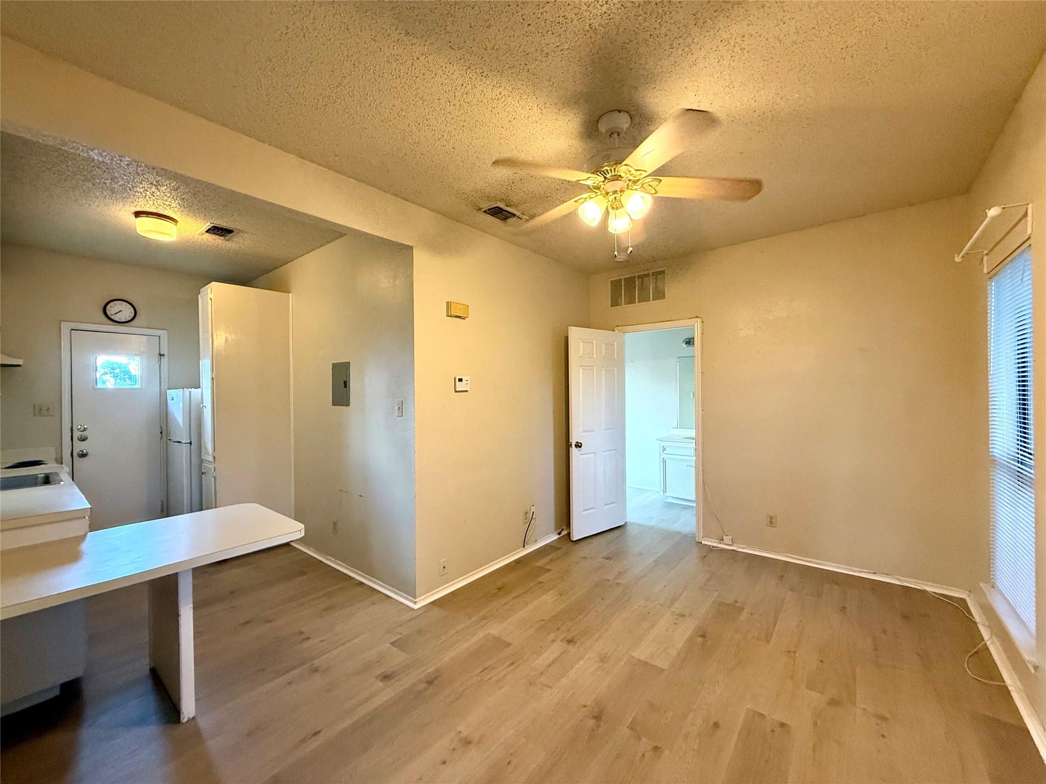 Smooth wood-look flooring anchors a functional la