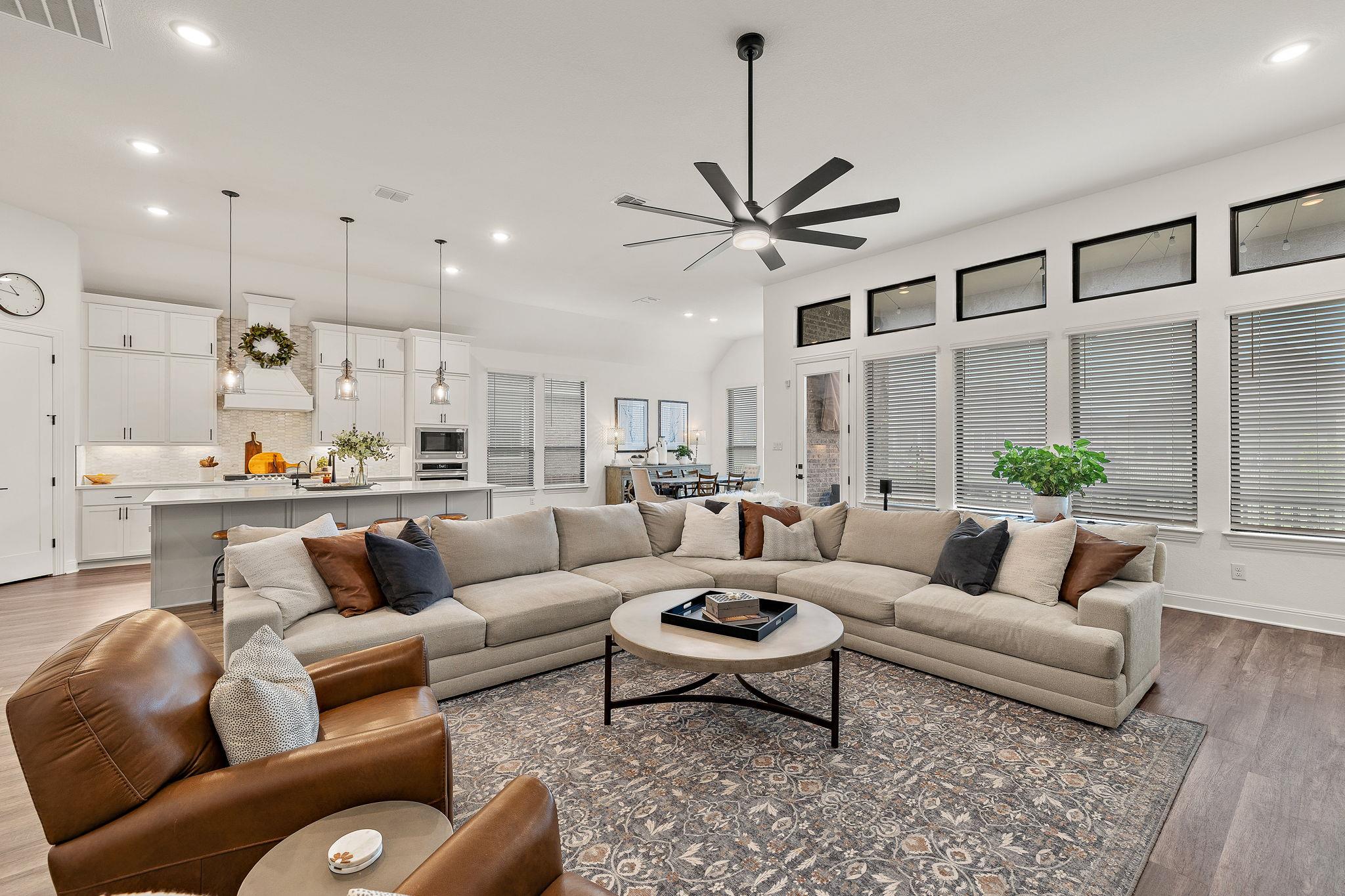 Open-concept living area featuring wood-finish fl
