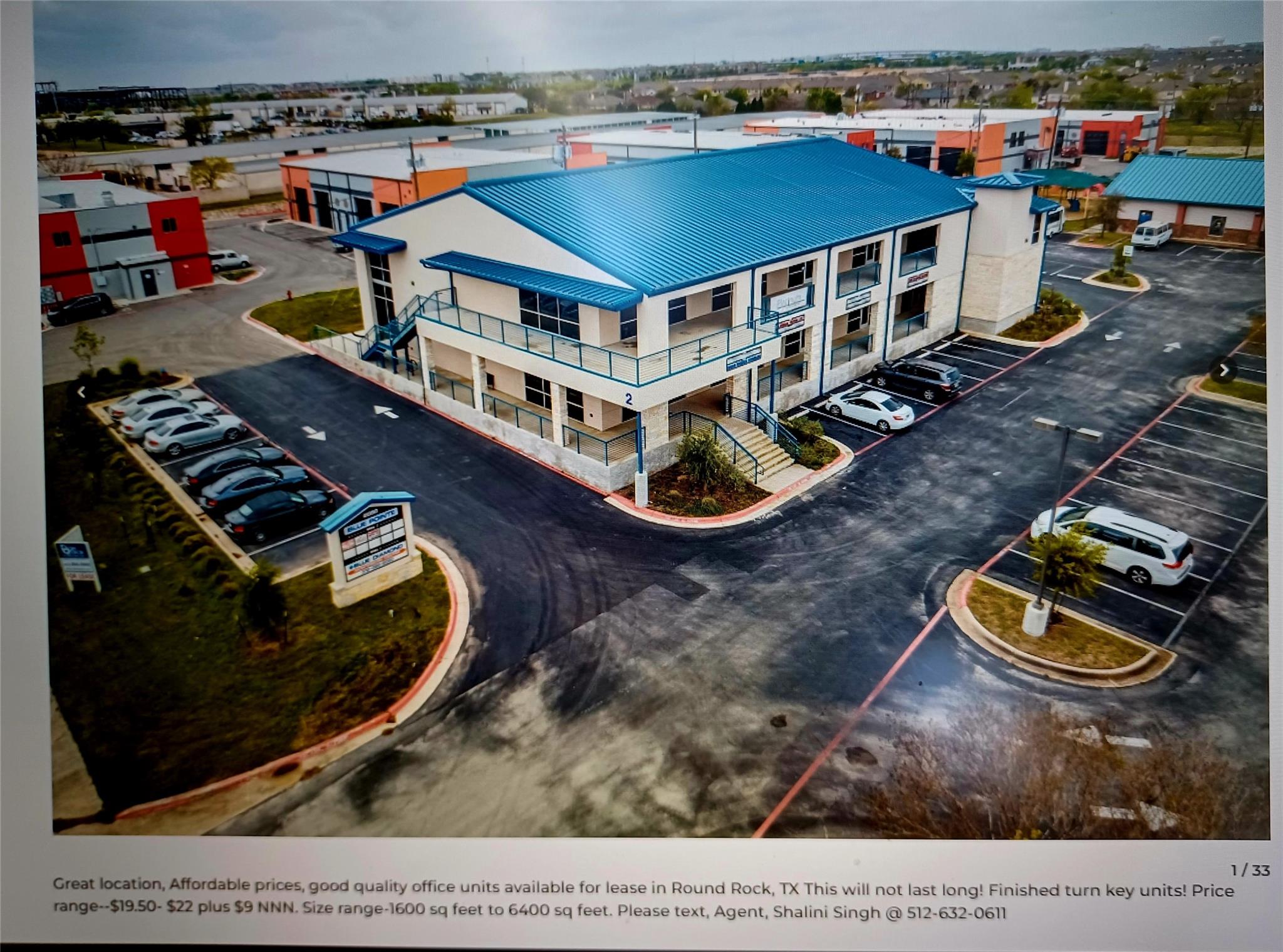 Two-story commercial building featuring a blue me
