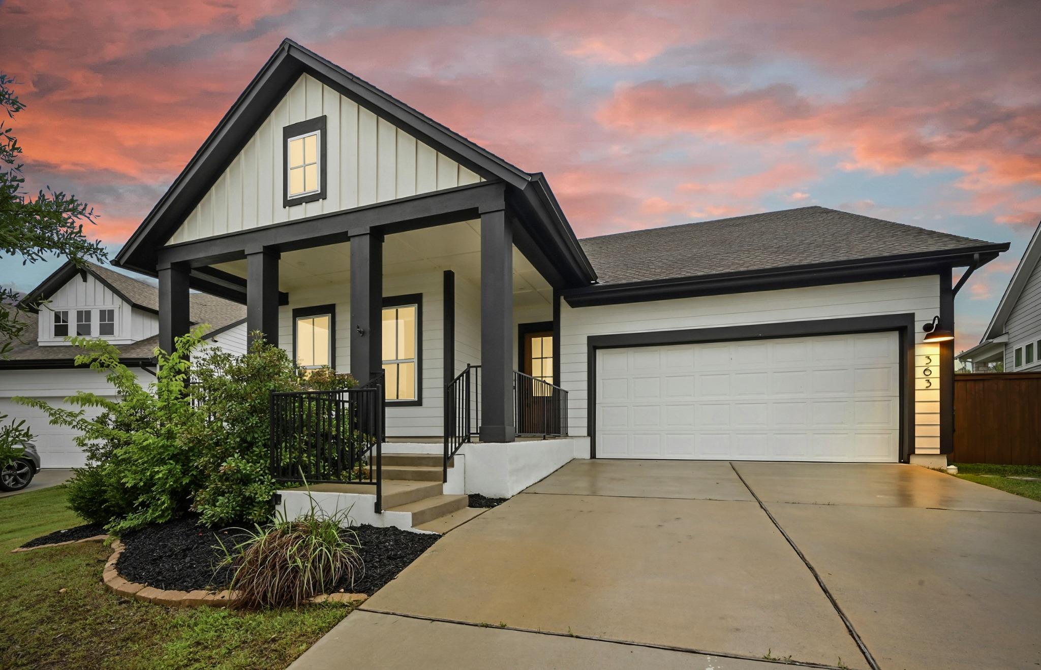 Modern farmhouse exterior featuring white board-a