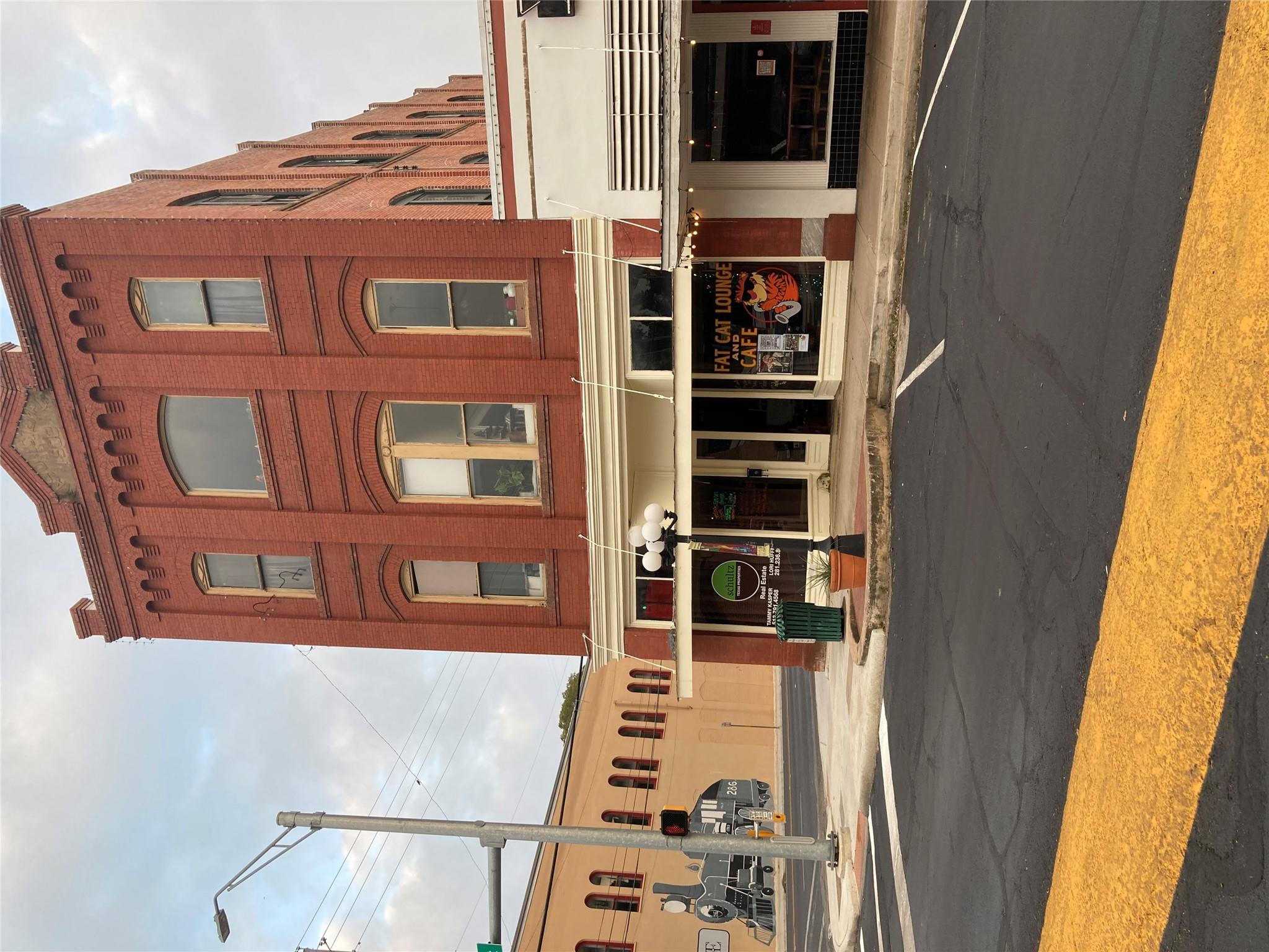 Brick commercial building featuring three stories