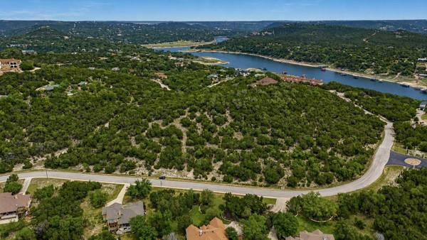 Expansive wooded lot with a paved road frontage, 