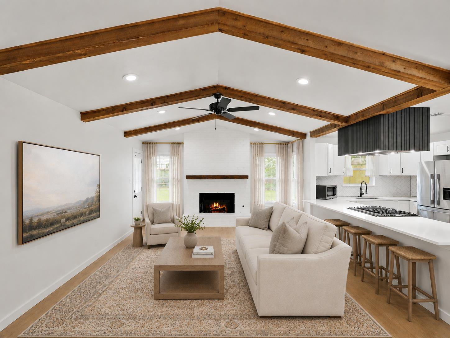 Vaulted ceiling with exposed wood beams, white br