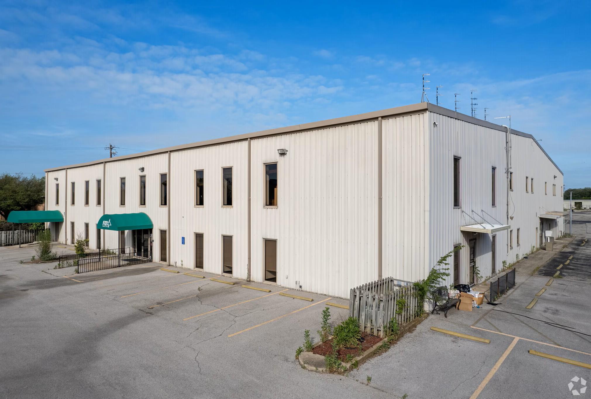 Commercial building with a large asphalt parking 