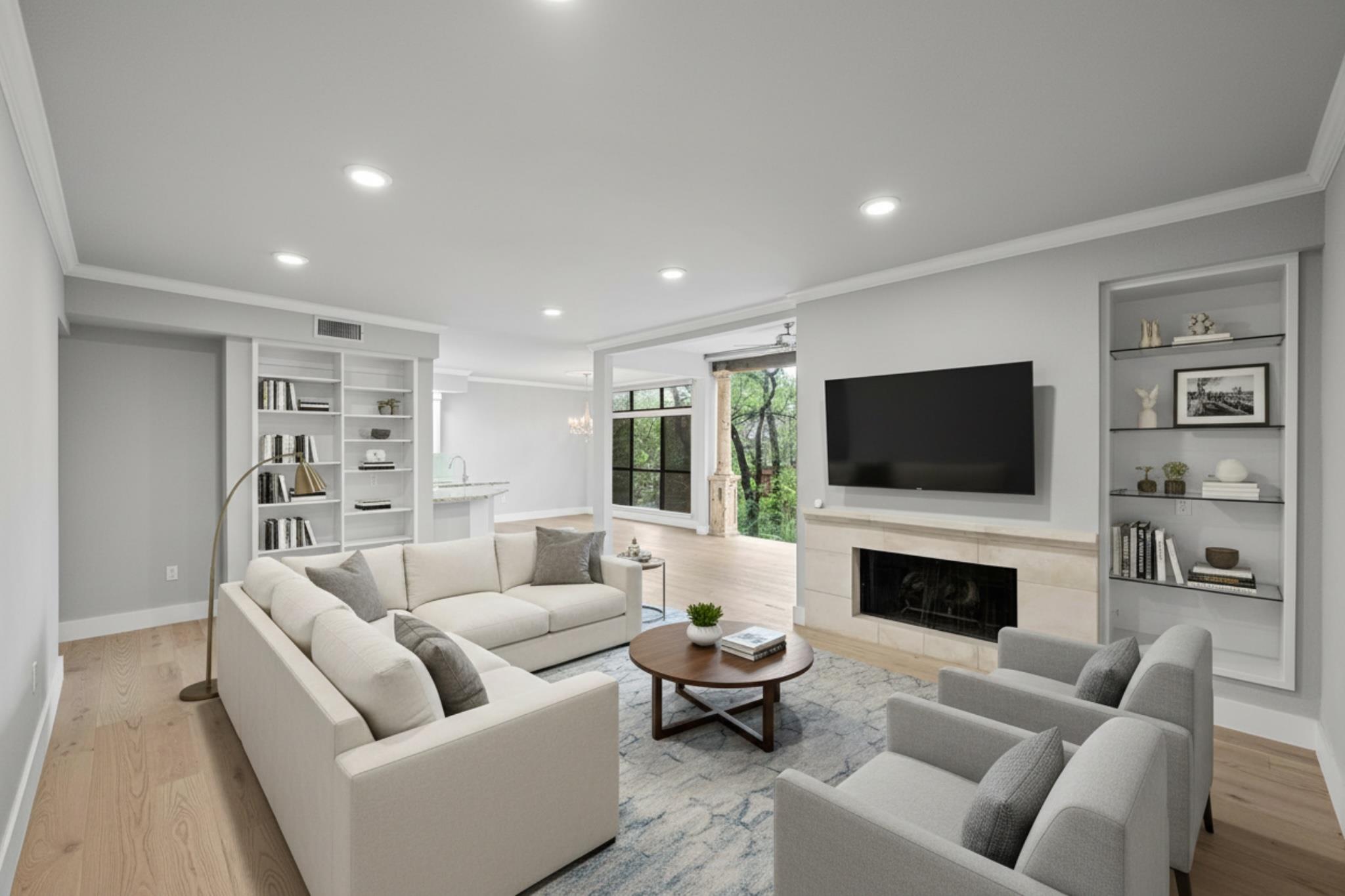 Spacious living area featuring light wood-finish 