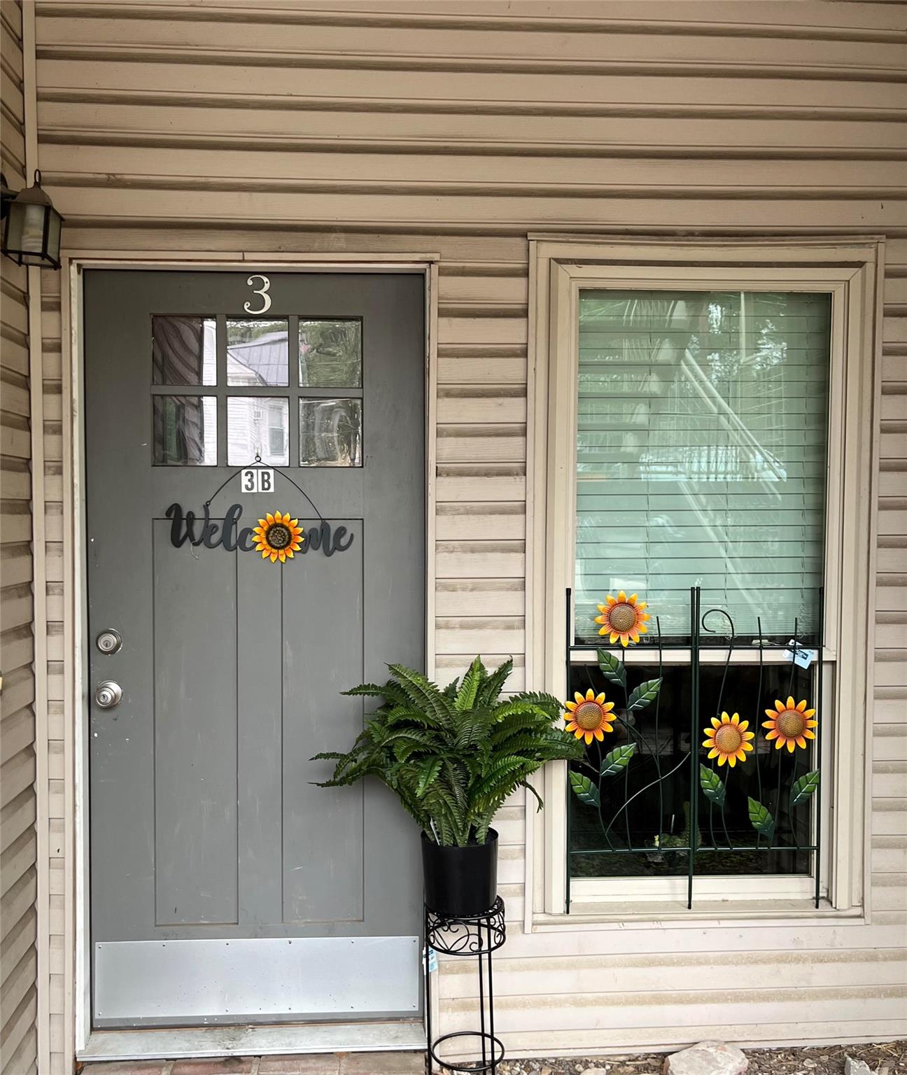 Entryway featuring a paneled door with multiple l