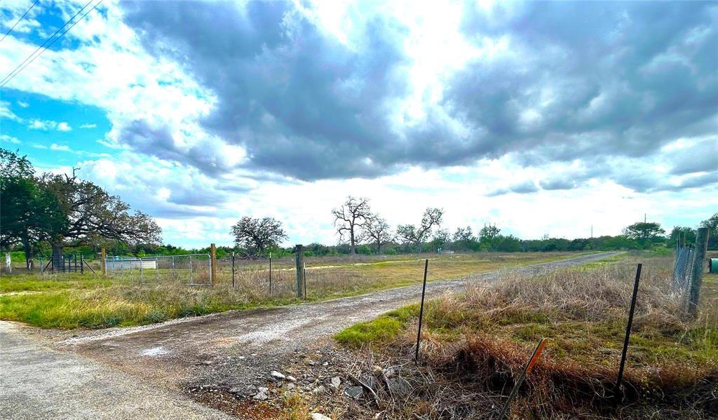 Expansive undeveloped land featuring a gravel roa