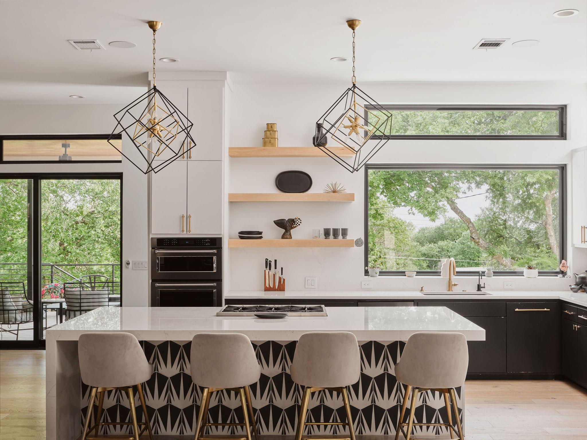 Contemporary kitchen featuring a white quartz isl