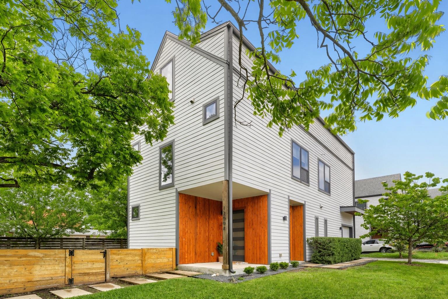 Contemporary multi-story residence featuring ligh