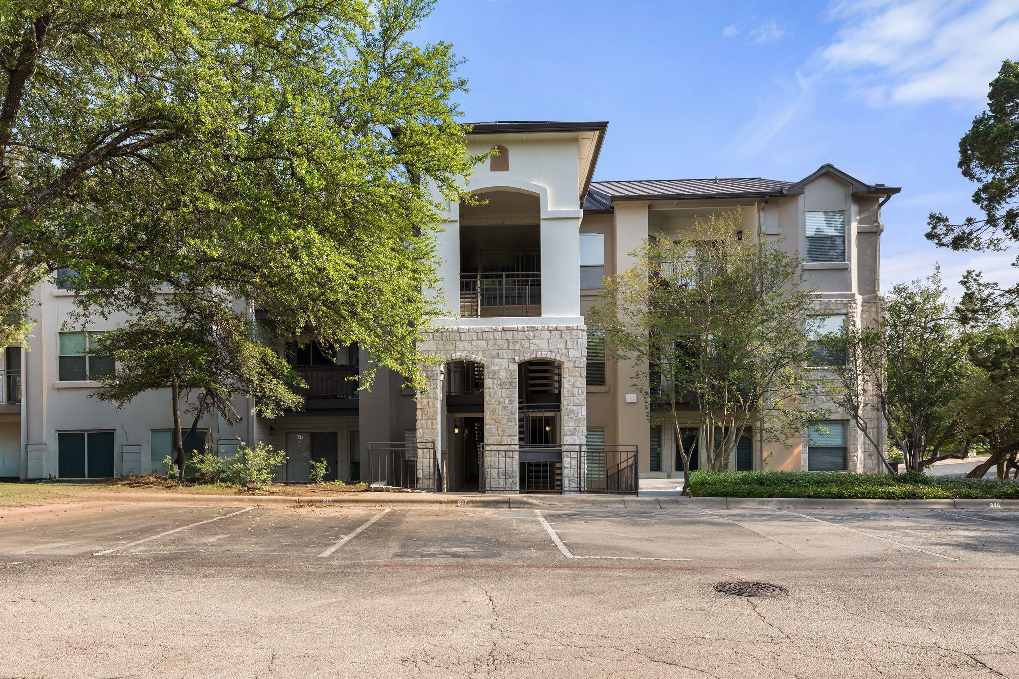 Multi-story building featuring a stone facade and