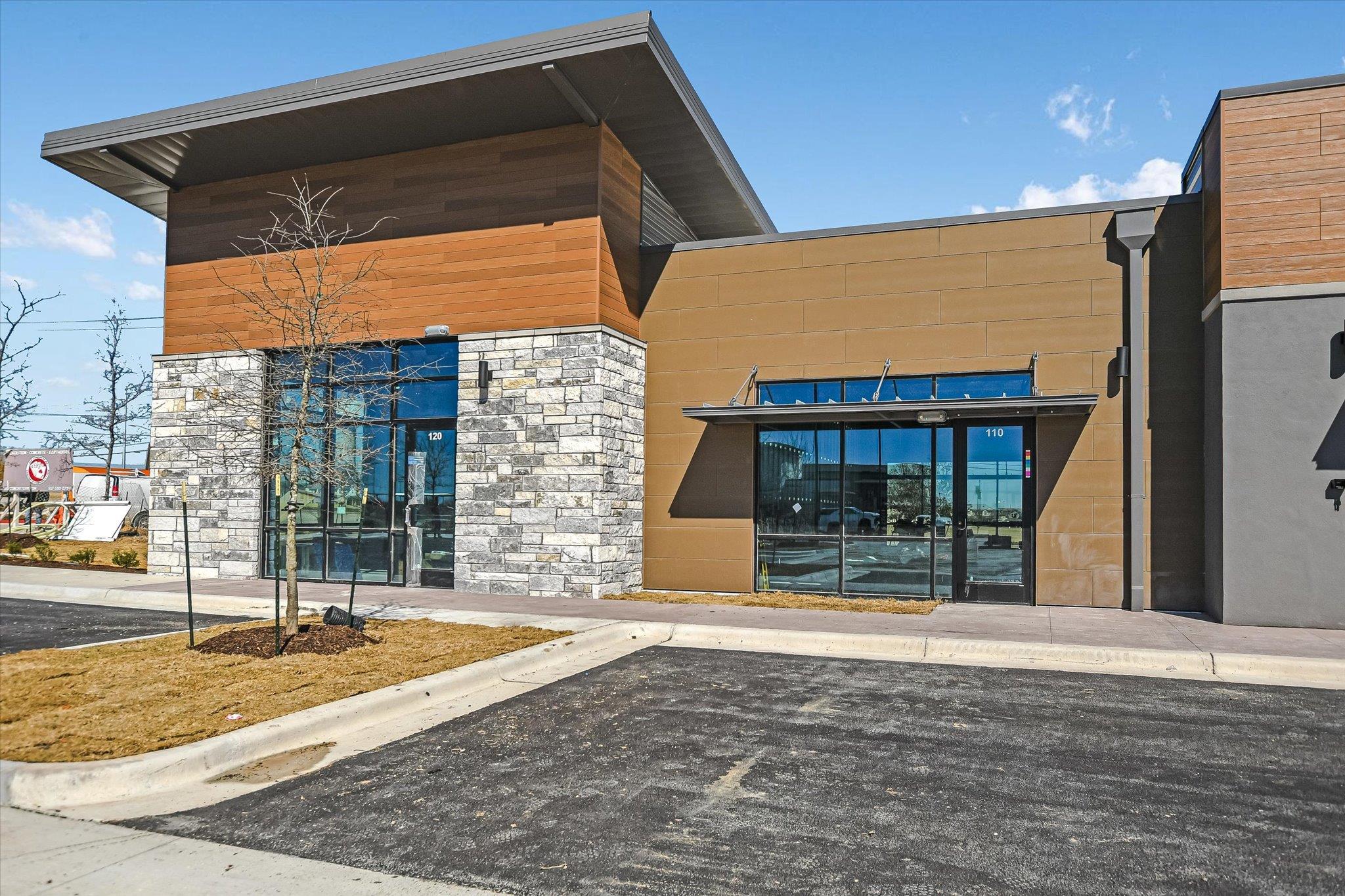 Contemporary commercial building featuring a ston