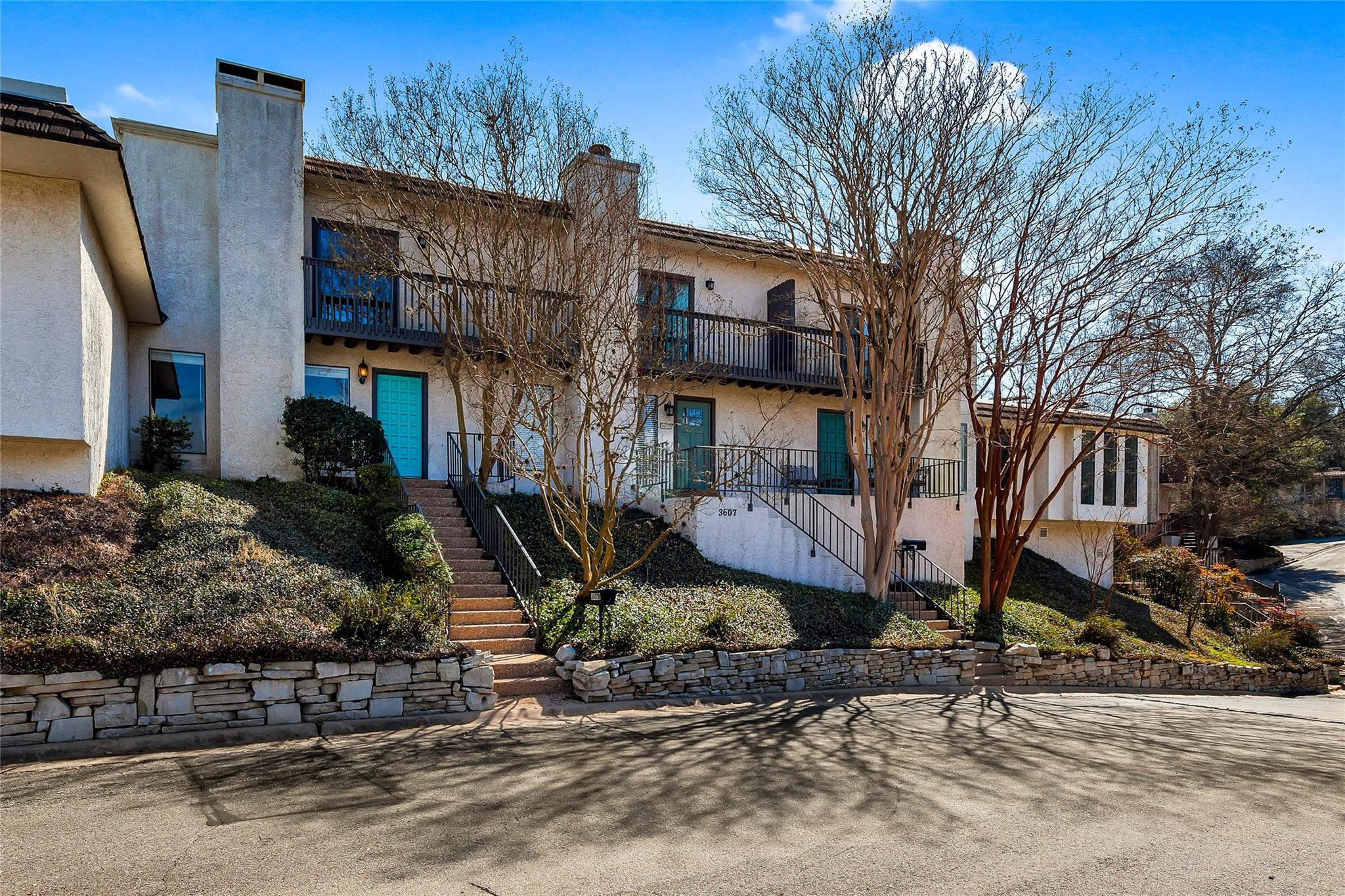Multi-level stucco exterior with multiple balconi