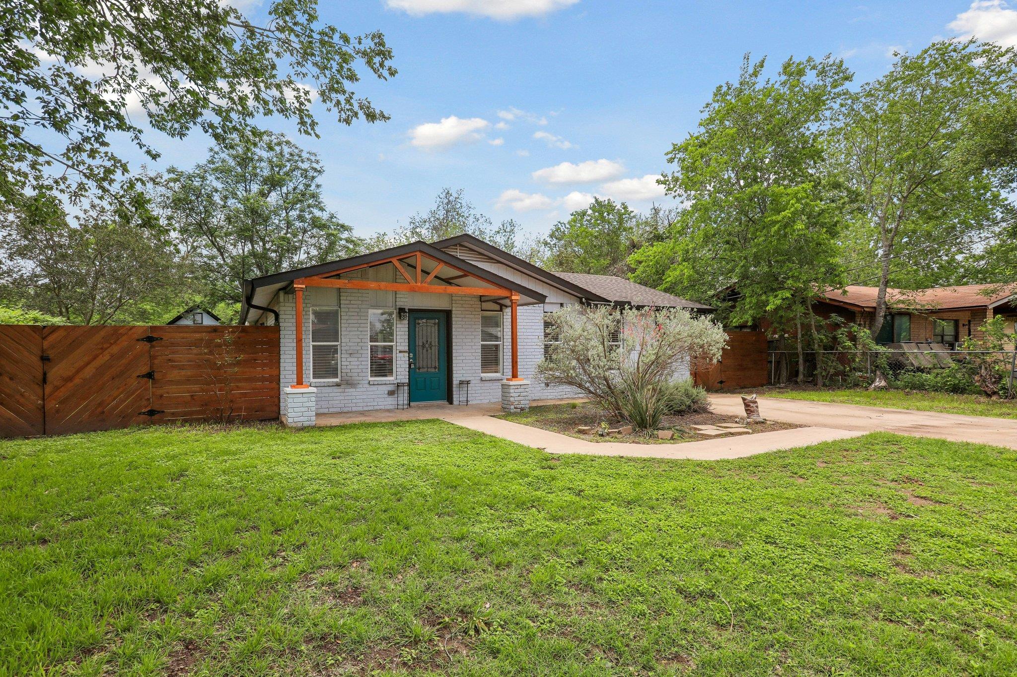 Front exterior featuring a covered porch with exp