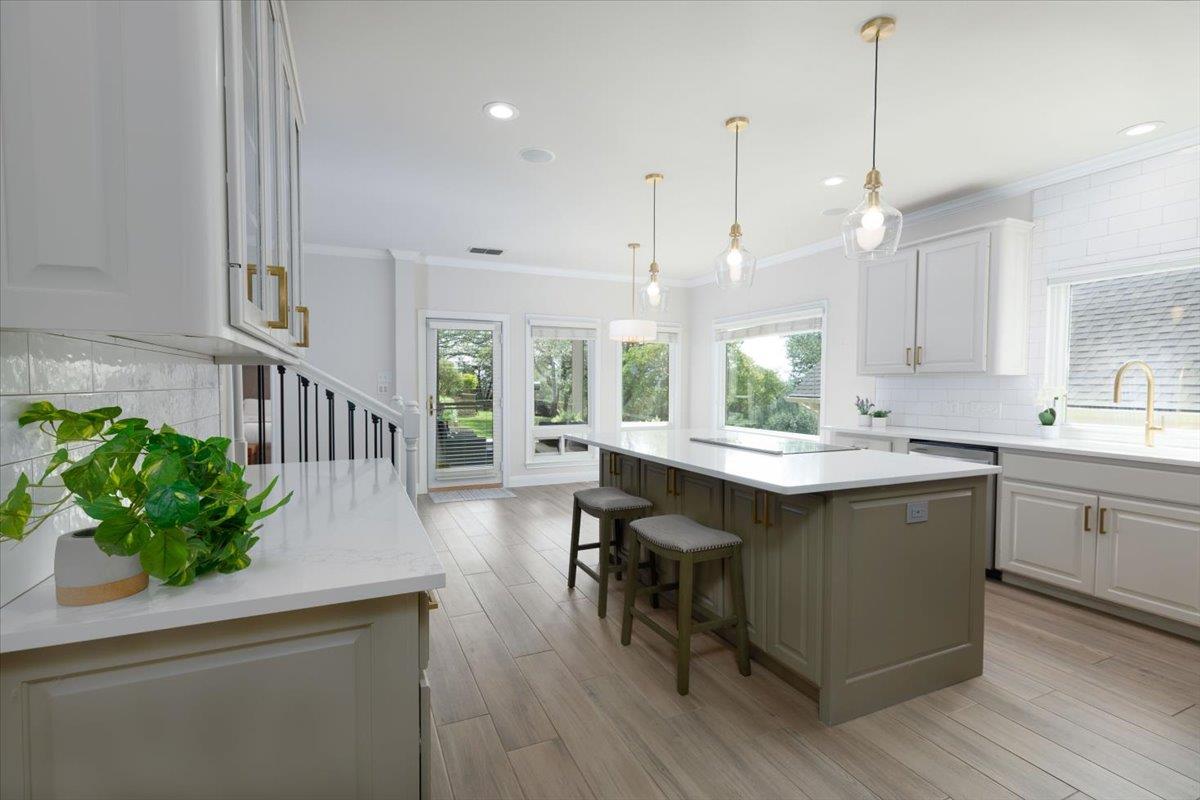 Open-concept kitchen featuring an expansive cente