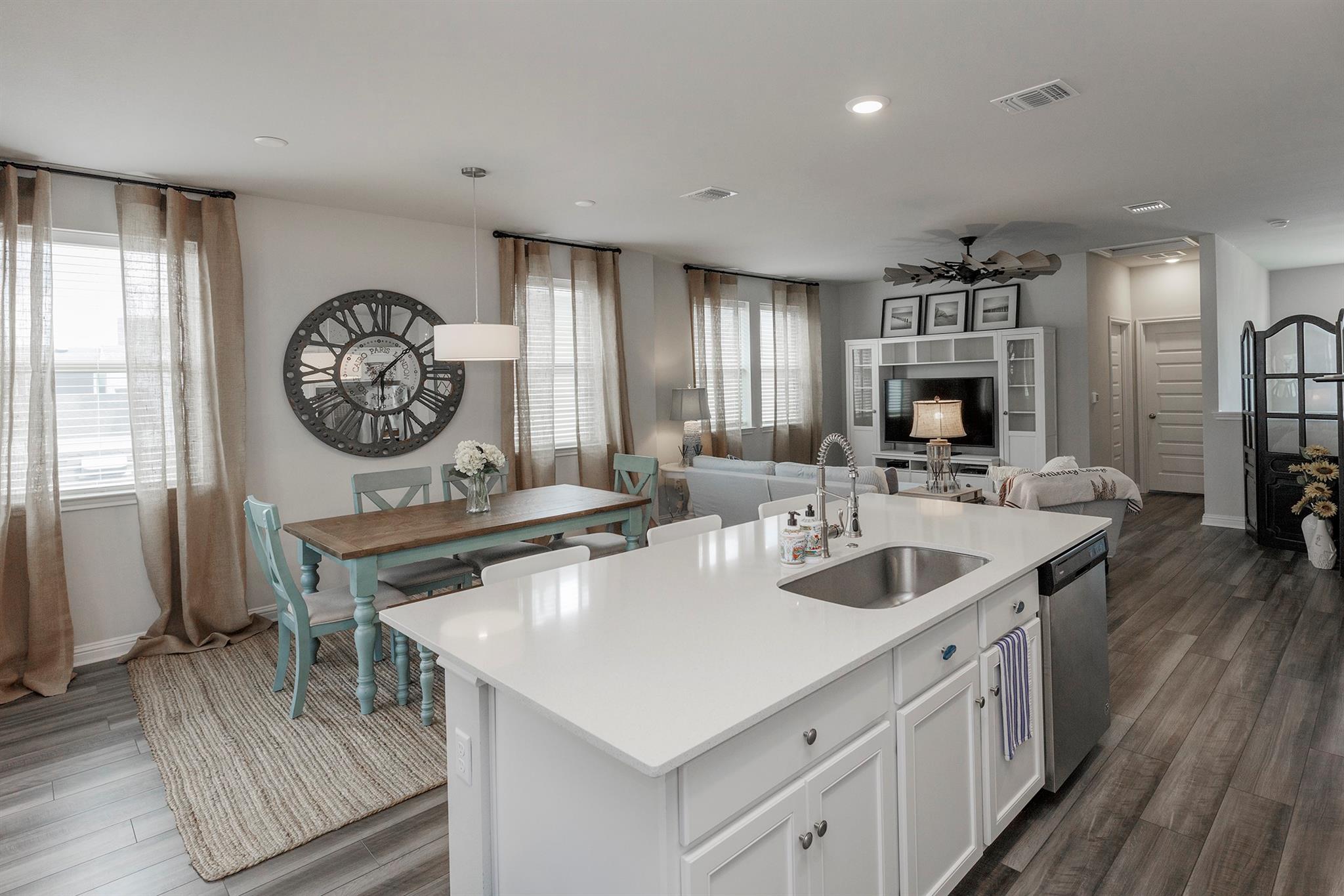 Kitchen island featuring a stainless steel sink a