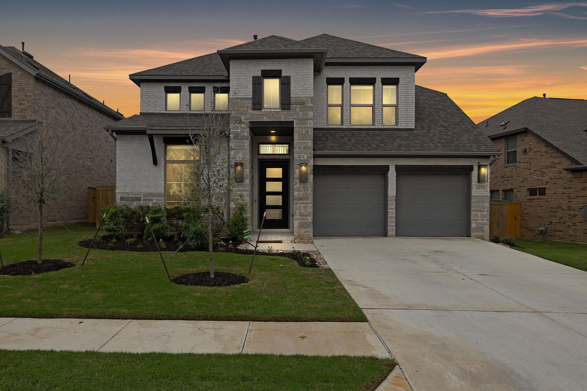 Two-story home with a brick and stone facade