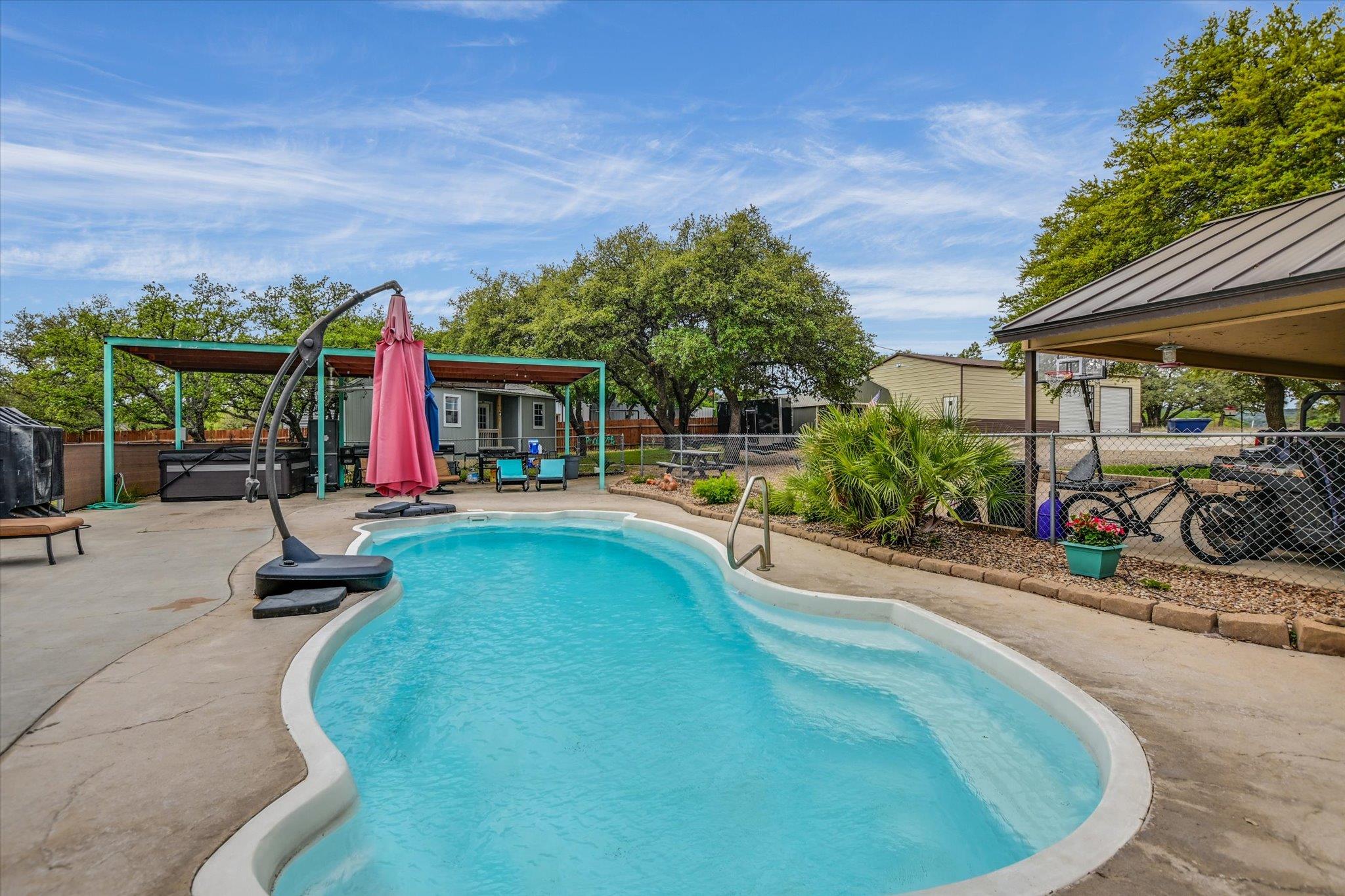 Freeform swimming pool with integrated steps, sur