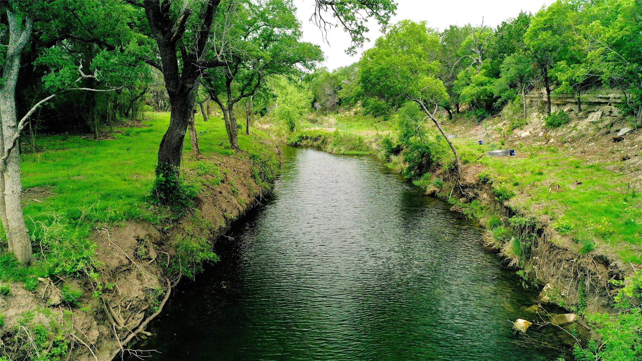 Waterfront property featuring a tranquil stream b