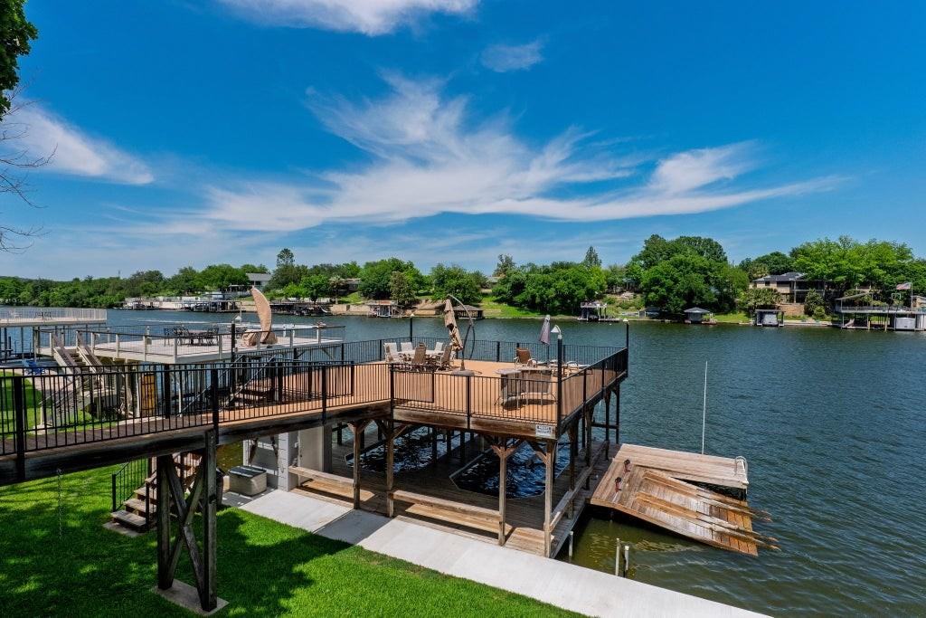 Multi-level wooden docks extend over the water, o