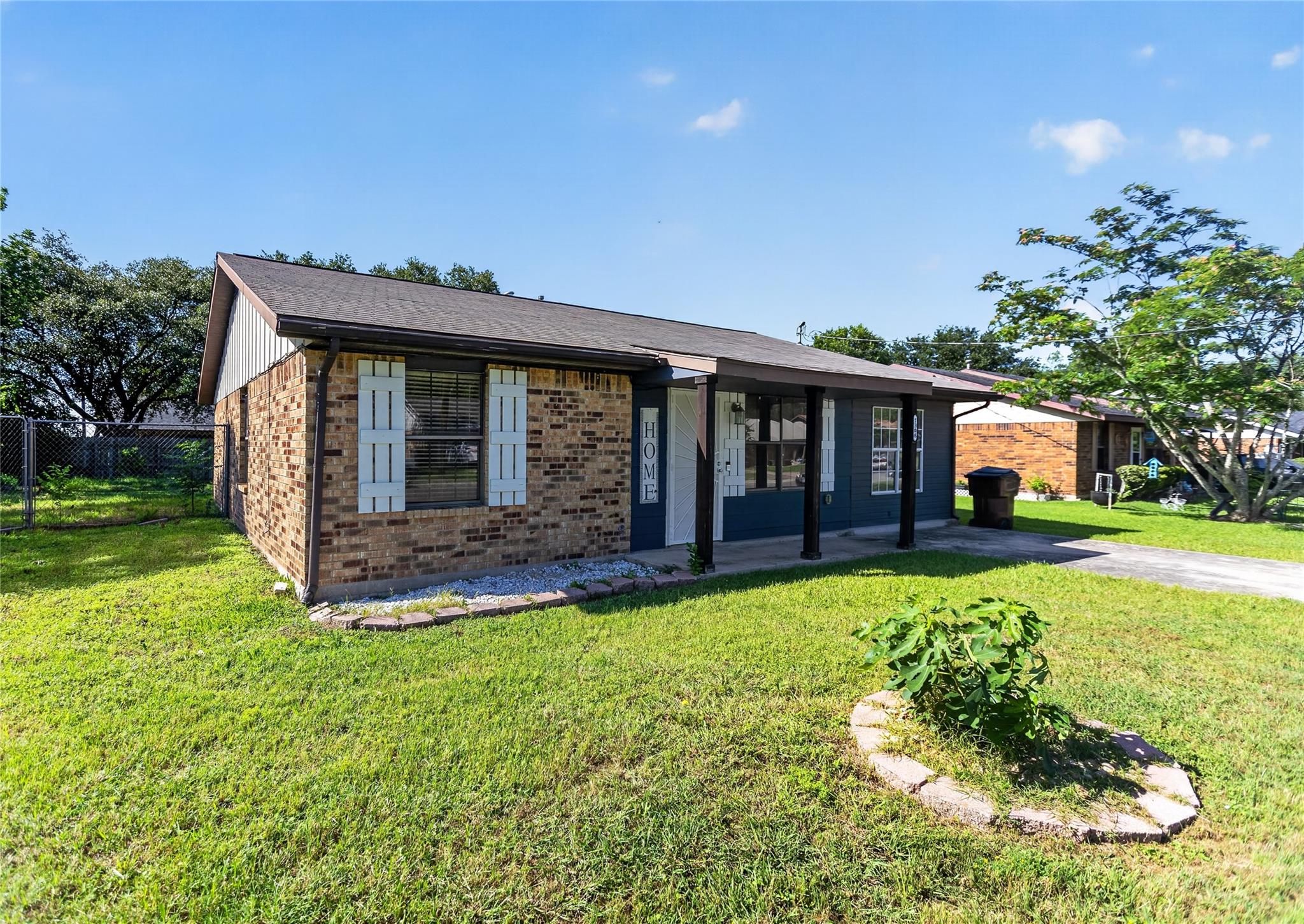 Brick and siding exterior with a covered front po