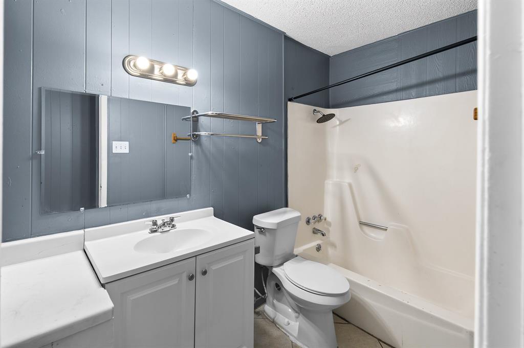 Bathroom featuring a white vanity with integrated