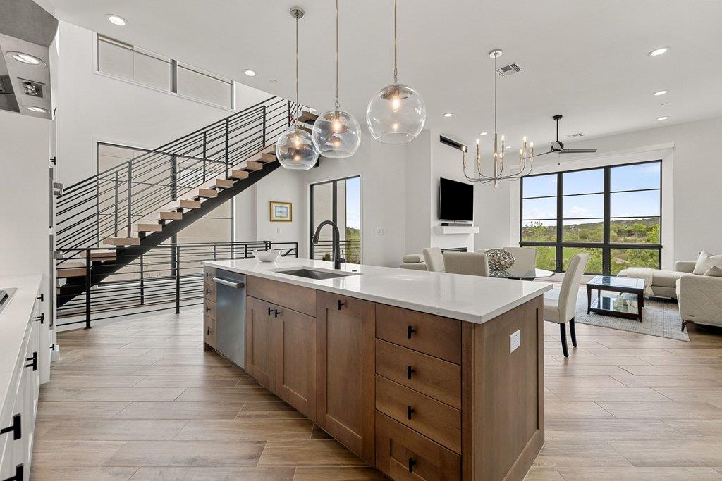Open-concept living space featuring a central kit