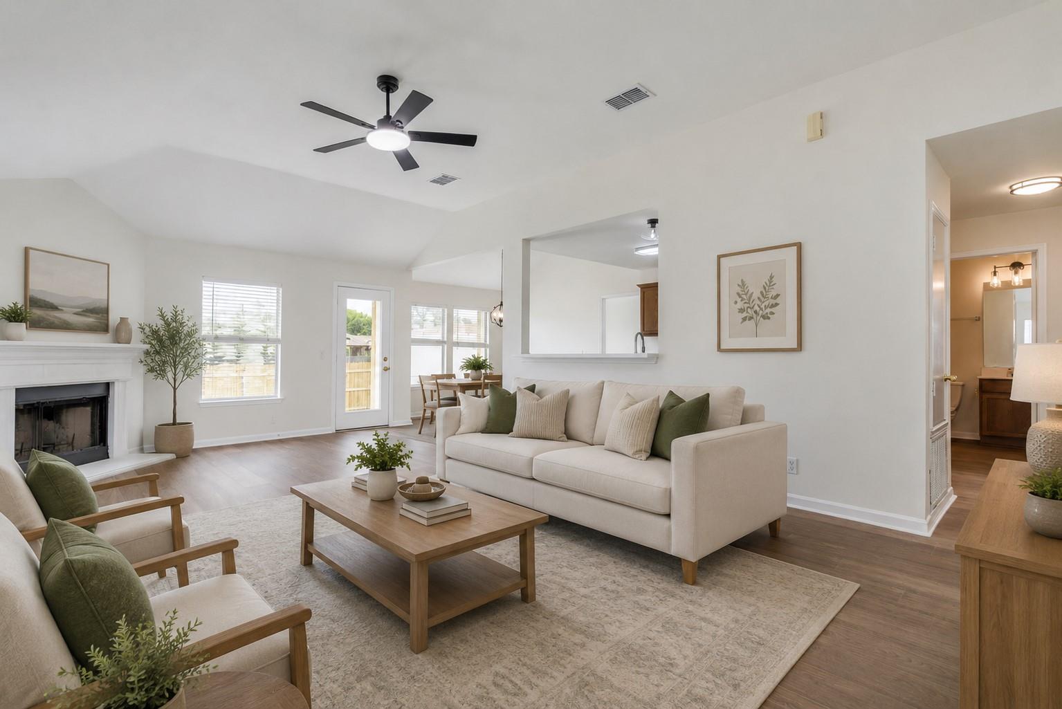 A fireplace and warm wood flooring enhance this n