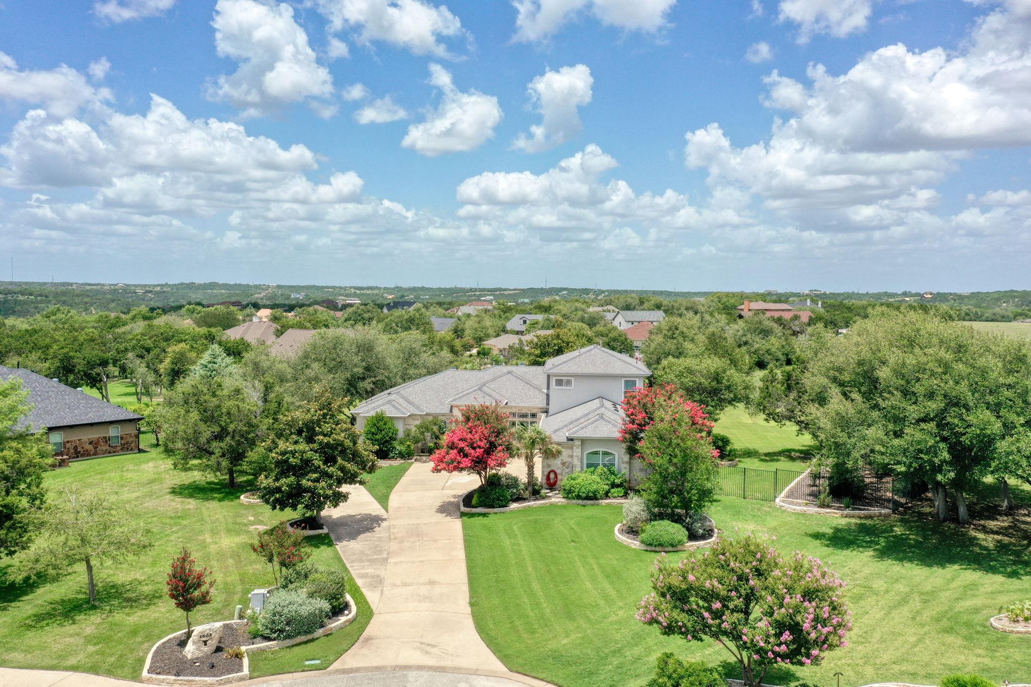 Expansive residential property featuring a gray-r