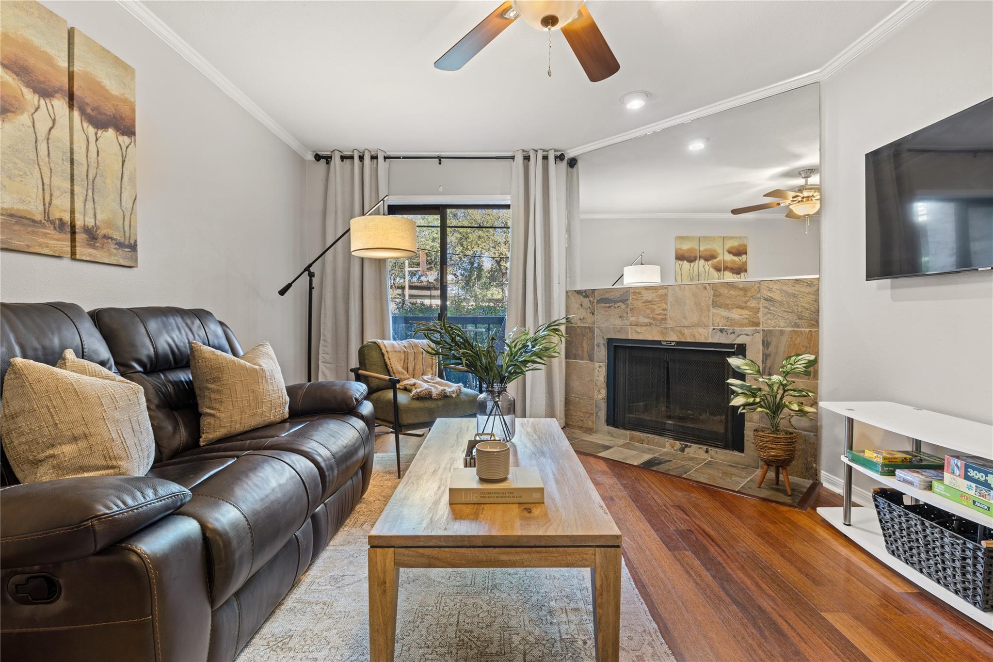 Living area featuring wood-finish flooring, a cor