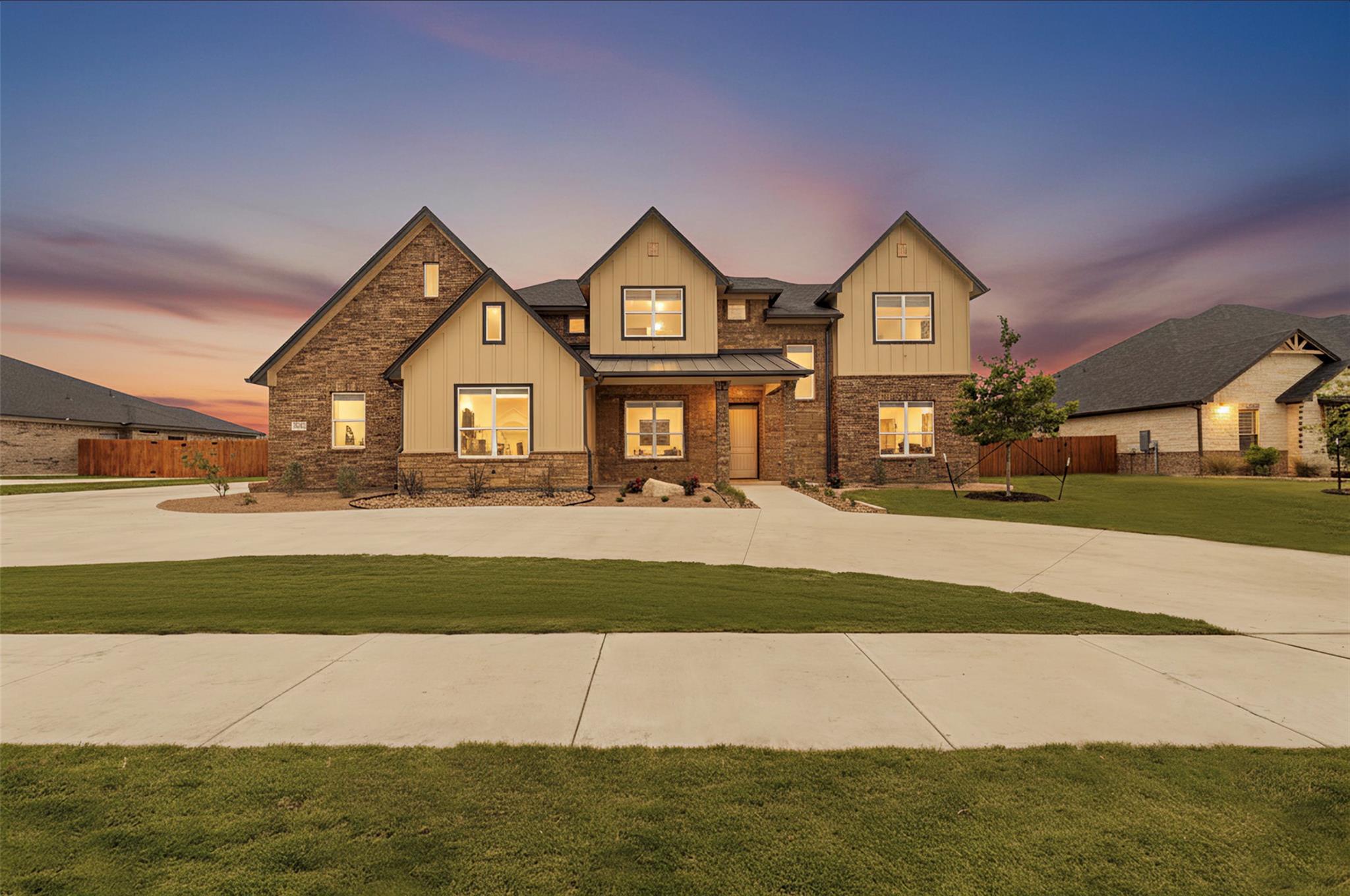 Expansive two-story residence featuring a stone a