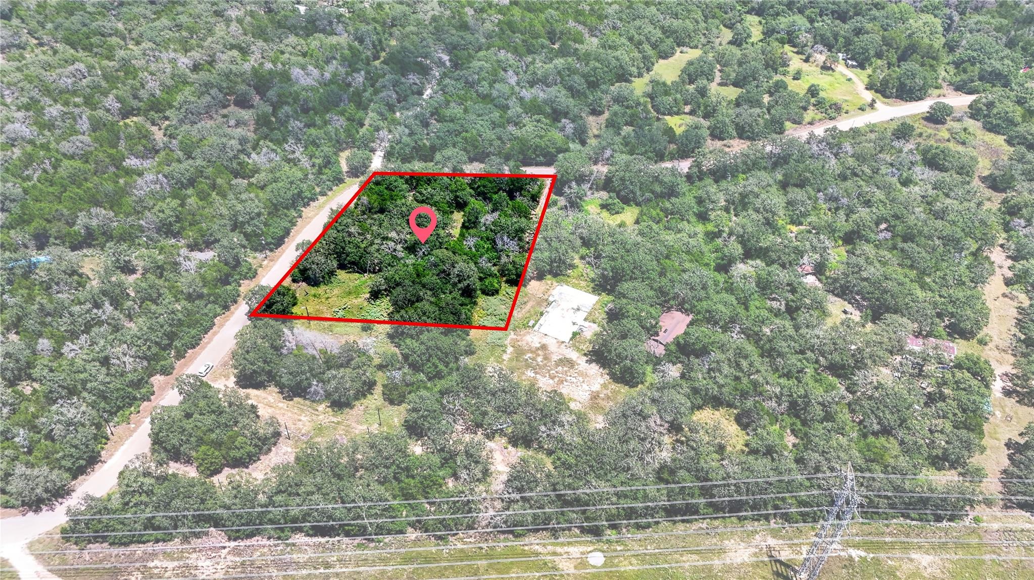 Thick stands of mature trees cover this private a