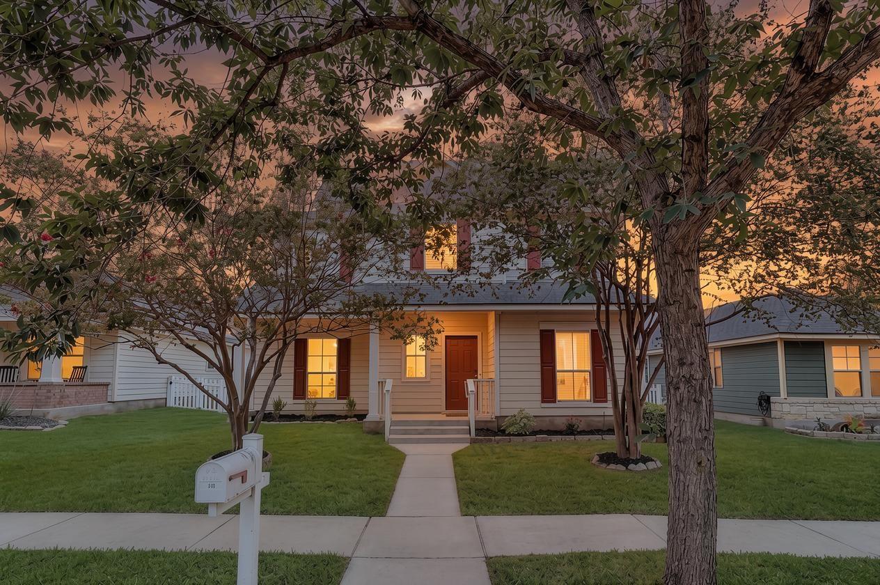 A welcoming home with a covered front porch, fram