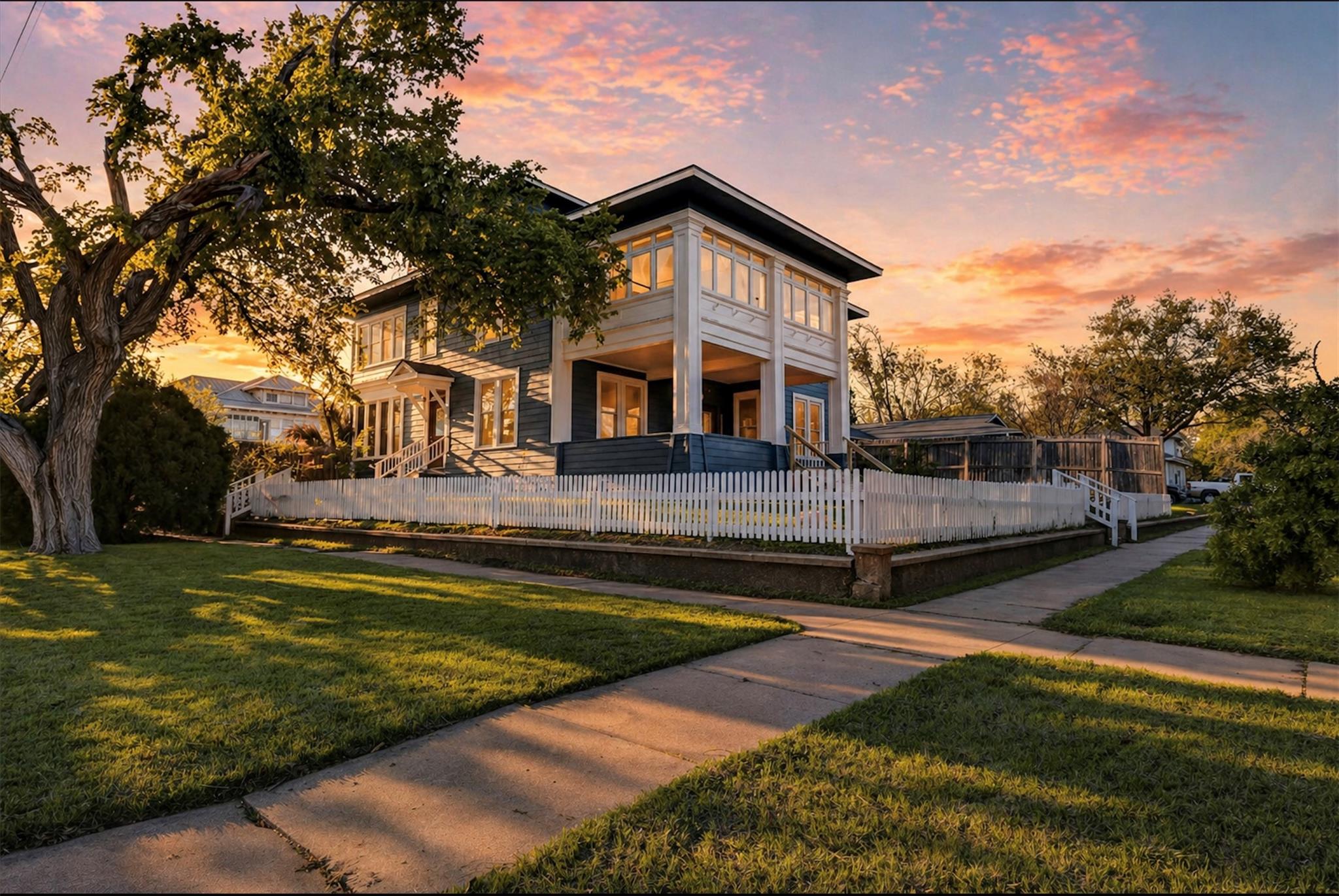 Two-story residential structure featuring a white