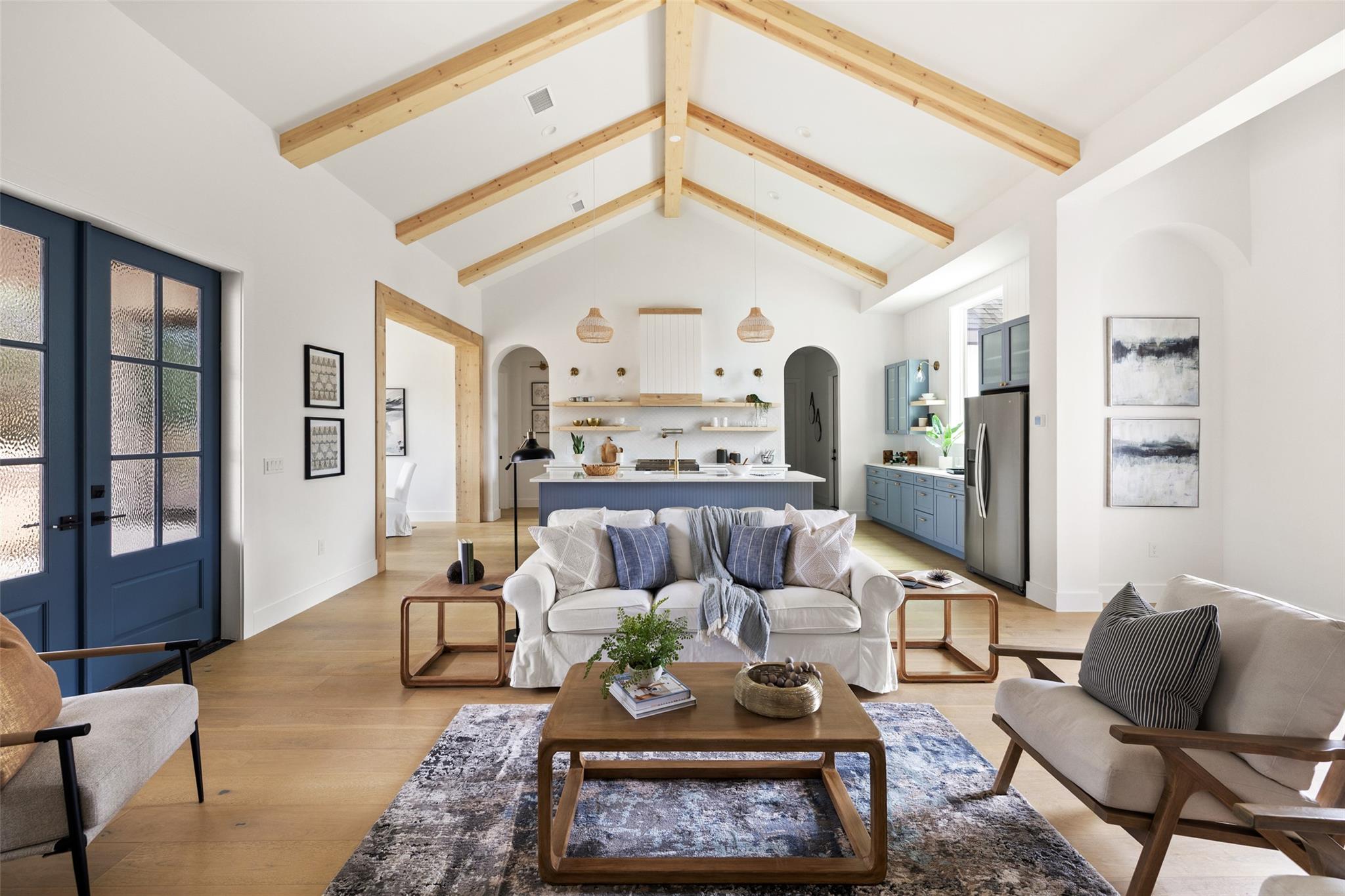 Vaulted ceilings with exposed wood beams define t