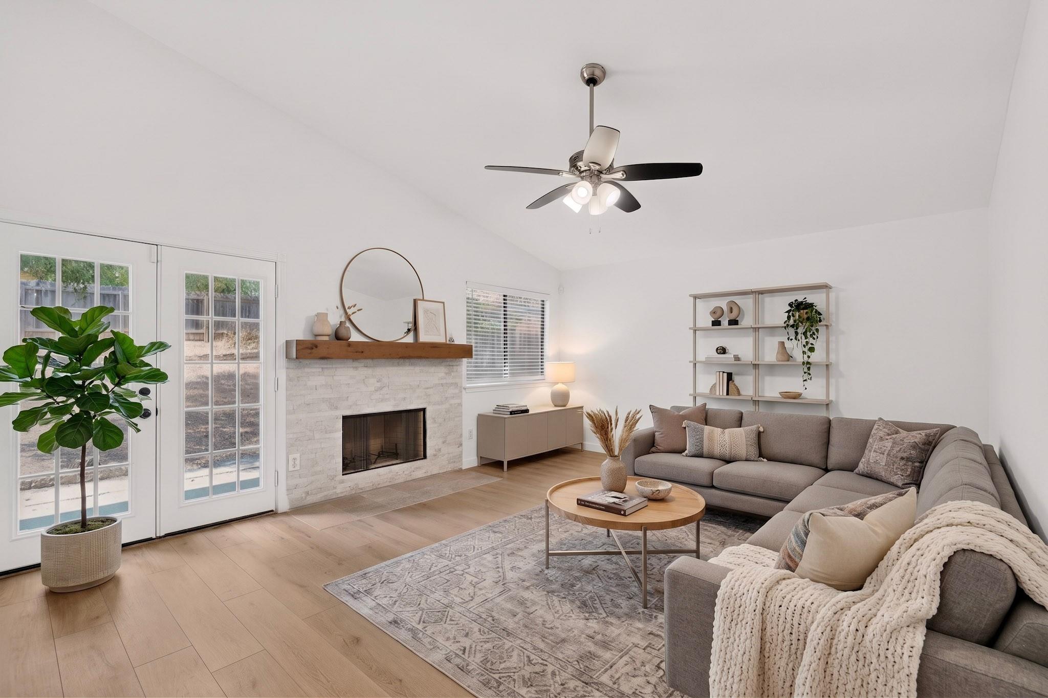 Vaulted ceilings and a stone fireplace define thi
