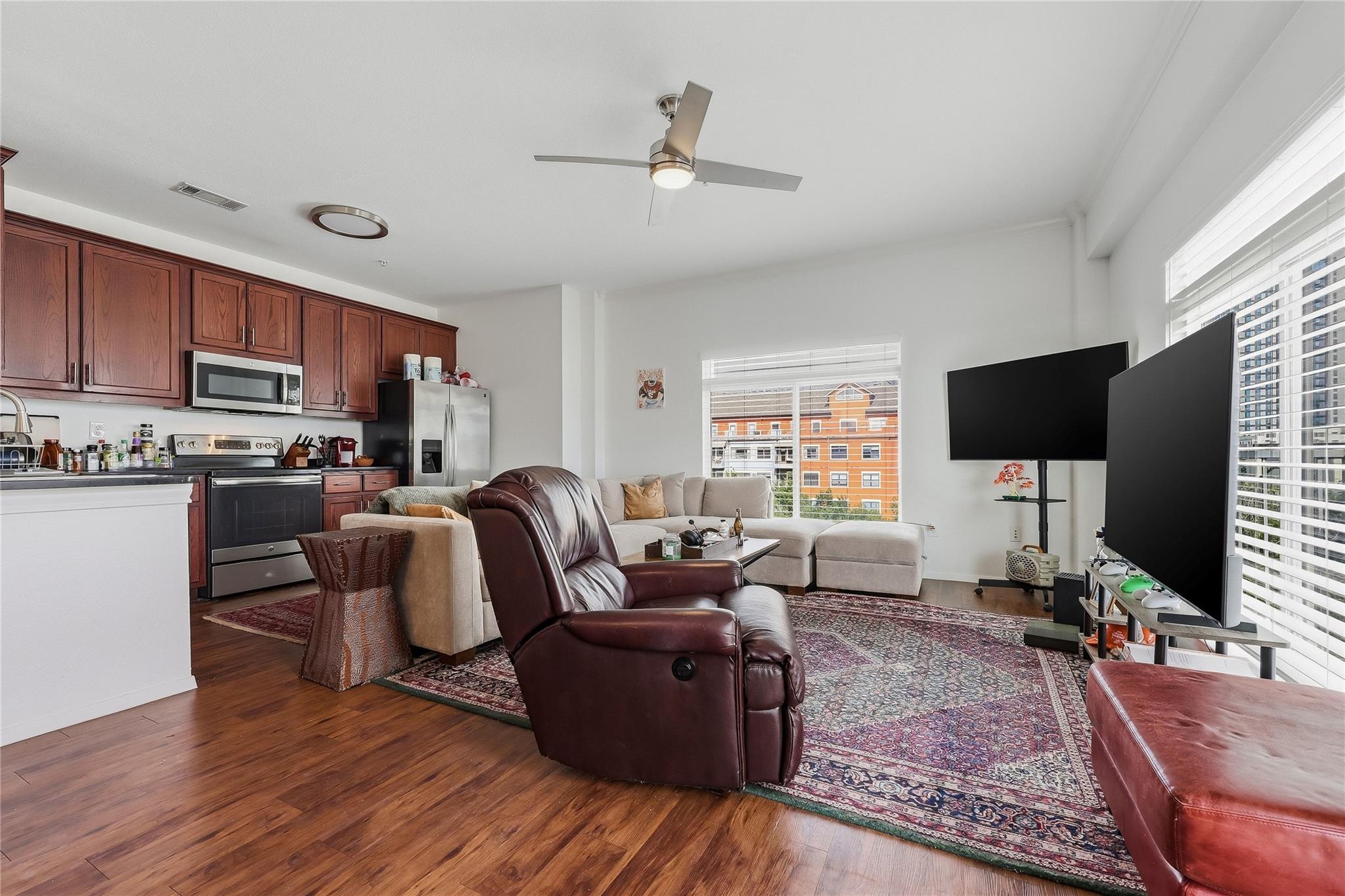 Open concept living space featuring wood-finish f