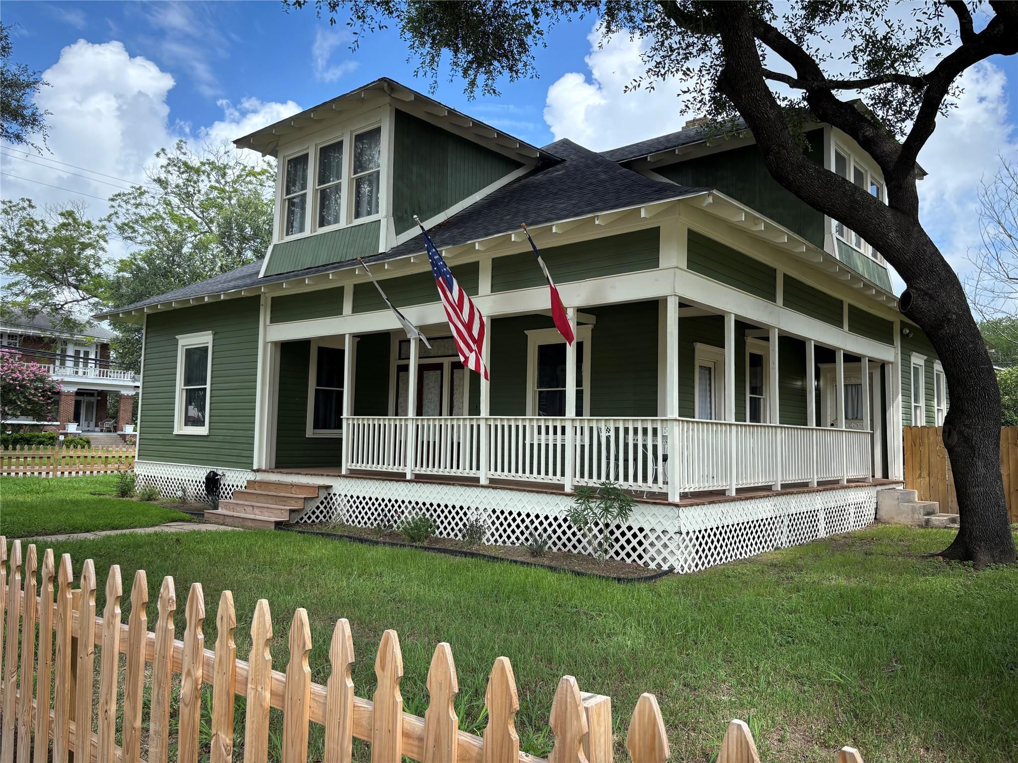 An inviting front porch with classic white railin