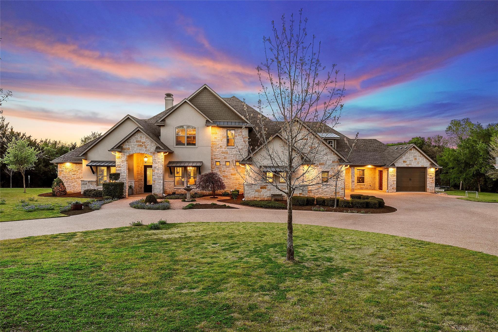 Stone and stucco exterior with multiple gables