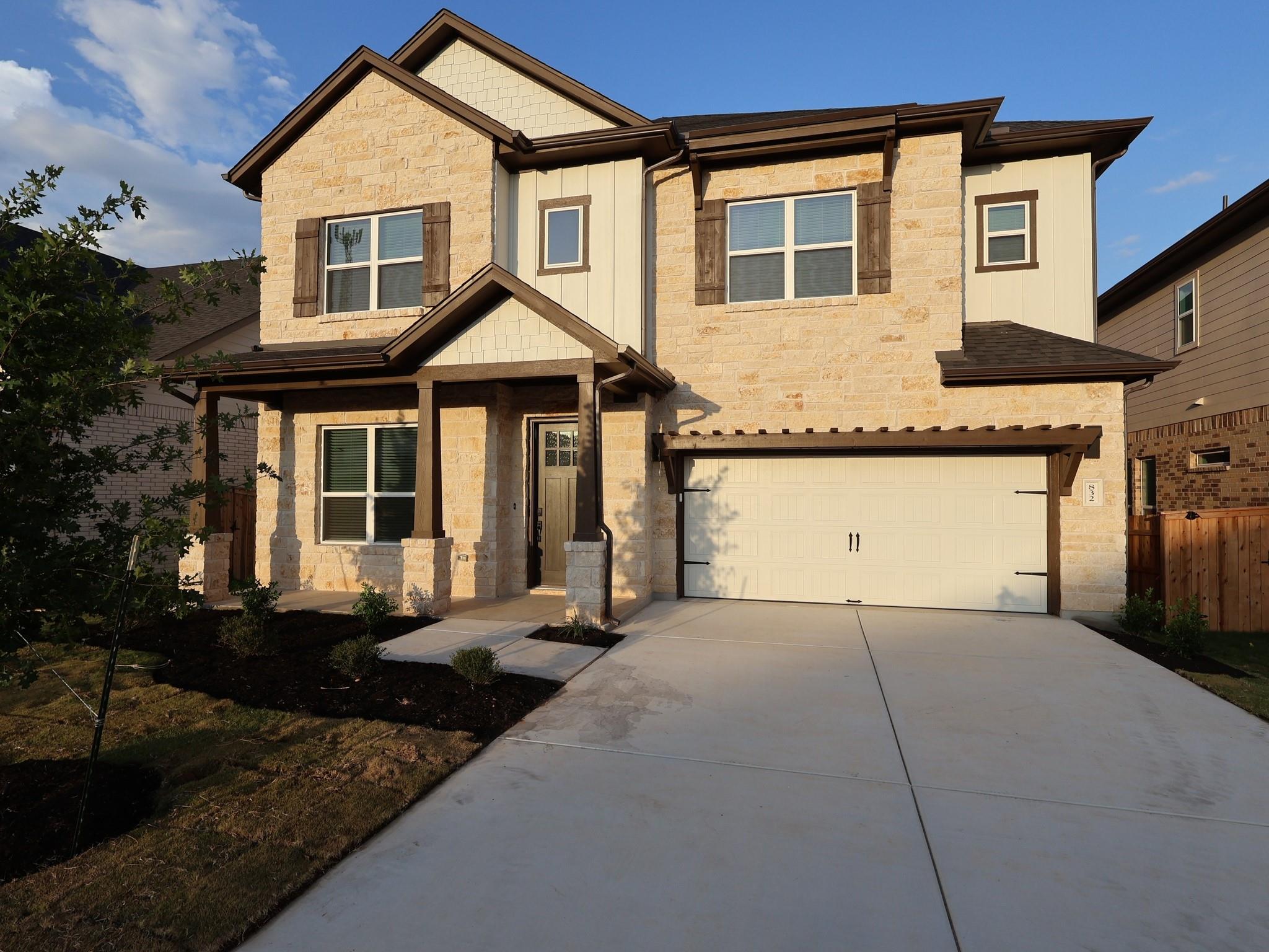 A charming stone and siding facade creates appeal